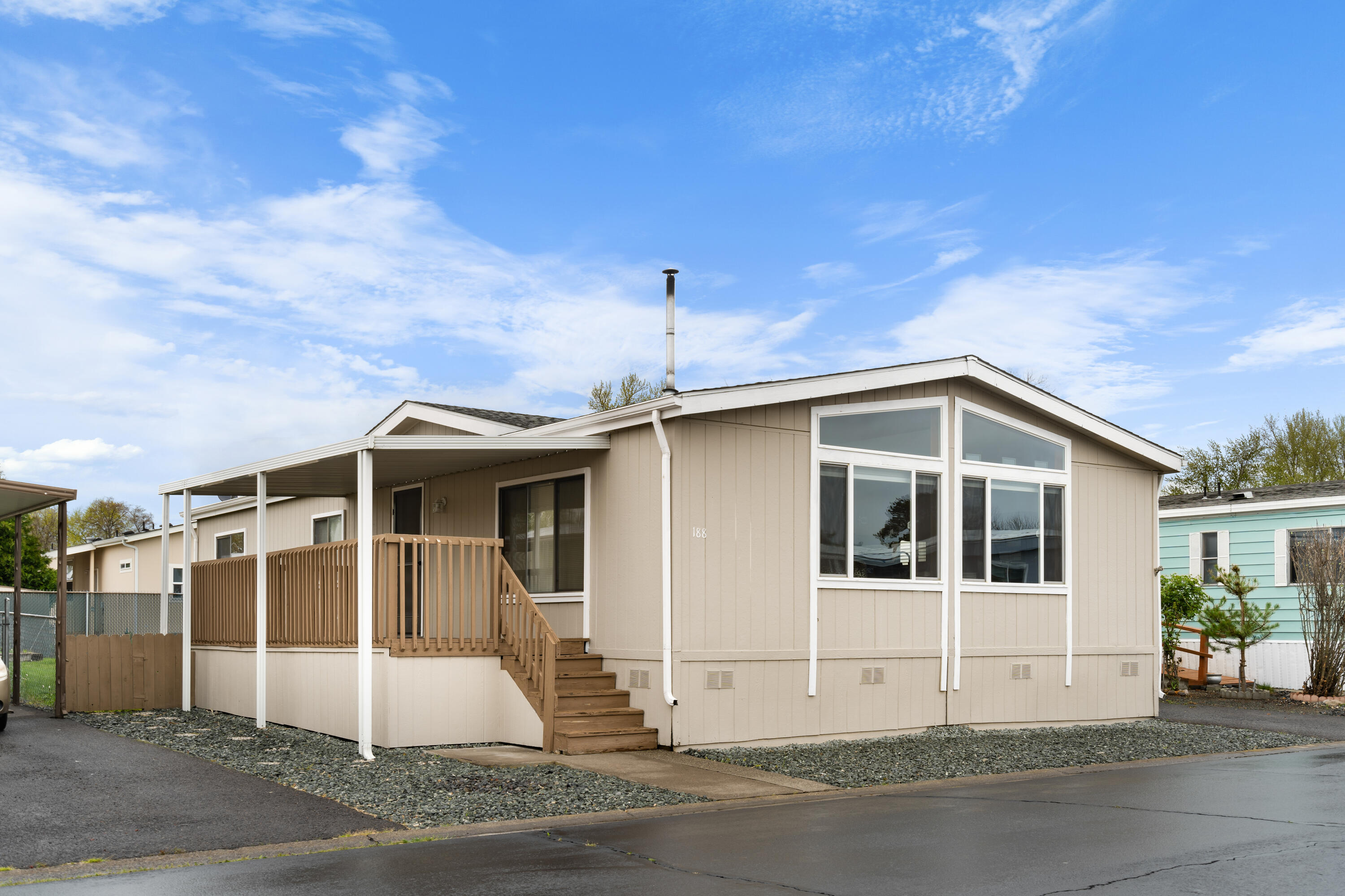 Mountain Views AND a huge yard?? Yes...Discover your dream home at this all ages park- Medford Estates! This spacious 3-bedroom, 2-bathroom, 1404 SqFt double-wide manufactured home offers comfort and convenience. Enjoy vibrant community living with a newly renovated clubhouse, featuring a ballroom and commercial kitchen. Stay active with a modern fitness room and indulge in outdoor joy at the new pool, spa, playground, pet park, and BBQ patio. With covered mail center and pool tables, convenience meets luxury in this all-age mobile home community. Welcome to a lifestyle of comfort, community, and endless adventure!