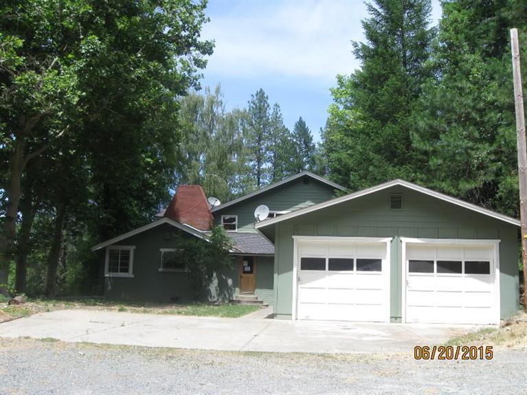 Large home in gorgeous rural setting complete with separate guest quarters, shop, and animal pen. 5 bedrooms, 2 full baths, open living area with loft and fireplace, large utility room and spacious kitchen. New interior paint and carpet, vinyl, new decking, move in ready condition! Seller offers buyer credit up to $500 for home warranty on owner occupied purchases.
