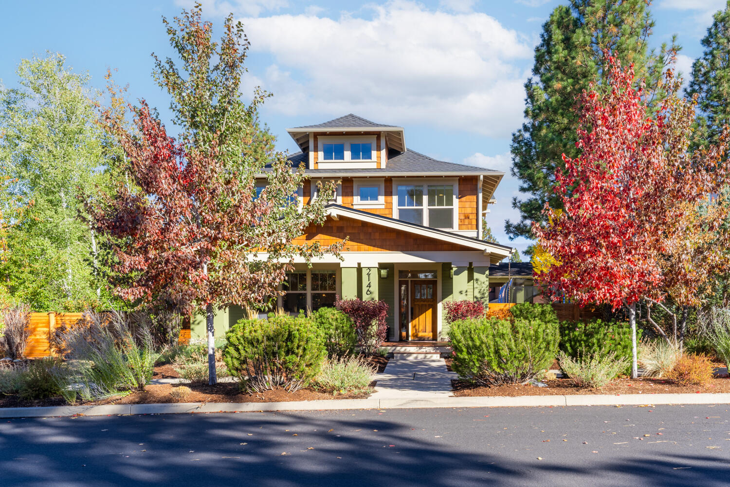 Here is your chance to live in Bend's sought-after Northwest Crossing! This 4-bed, 3-bath, 2611 sq/ft Earth Advantage Gold home by Greg Welch (2011) offers abundant natural light, hardwoods, and a cozy gas fireplace with custom wood shelving. The gourmet kitchen features stone countertops, a stunning copper sink, artesian tile backsplash, and an island. Upstairs, a second living room awaits. The primary suite is a private sanctuary with a spa-like ensuite & WIC. Three more bedrooms, including a potential guest suite upstairs. Step into your private yard with raised beds, automatic irrigation, artificial turf, a gas firepit, and a hot tub.  New roof, carpet, California closets, and fully landscaped front/back yards in 2023. Lots of updates! Plenty of off-street parking/storage with rare 3rd carport and 2nd side yard. Walk or bike to nearby schools and enjoy the vibrant NW Crossing hosting a summer farmers market, restaurants, and boutiques. Enjoy modern luxury with that Bend lifestyle!