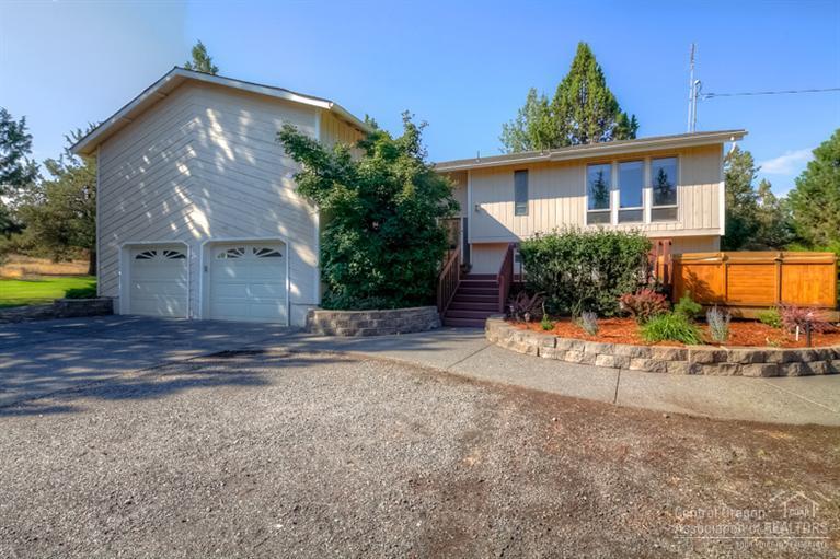 Privacy at it's best! Surrounded by lawns & natural landscape, this home is perfect for raising the family w/4 bedrooms, 2 family rooms & huge bonus area. Spacious Master Suite w/Jetted Tub, floor to ceiling windows. Bright home ready for your personal touch. Complete w/work shop that could be finished for additional bedrooms or living space. Split level w/expansive decks & hot tub/swim spa. Covered RV storage large enough for RV, boat & more! Heat pump, A/C, auto sprinklers, dbl garage w/openers - ready to