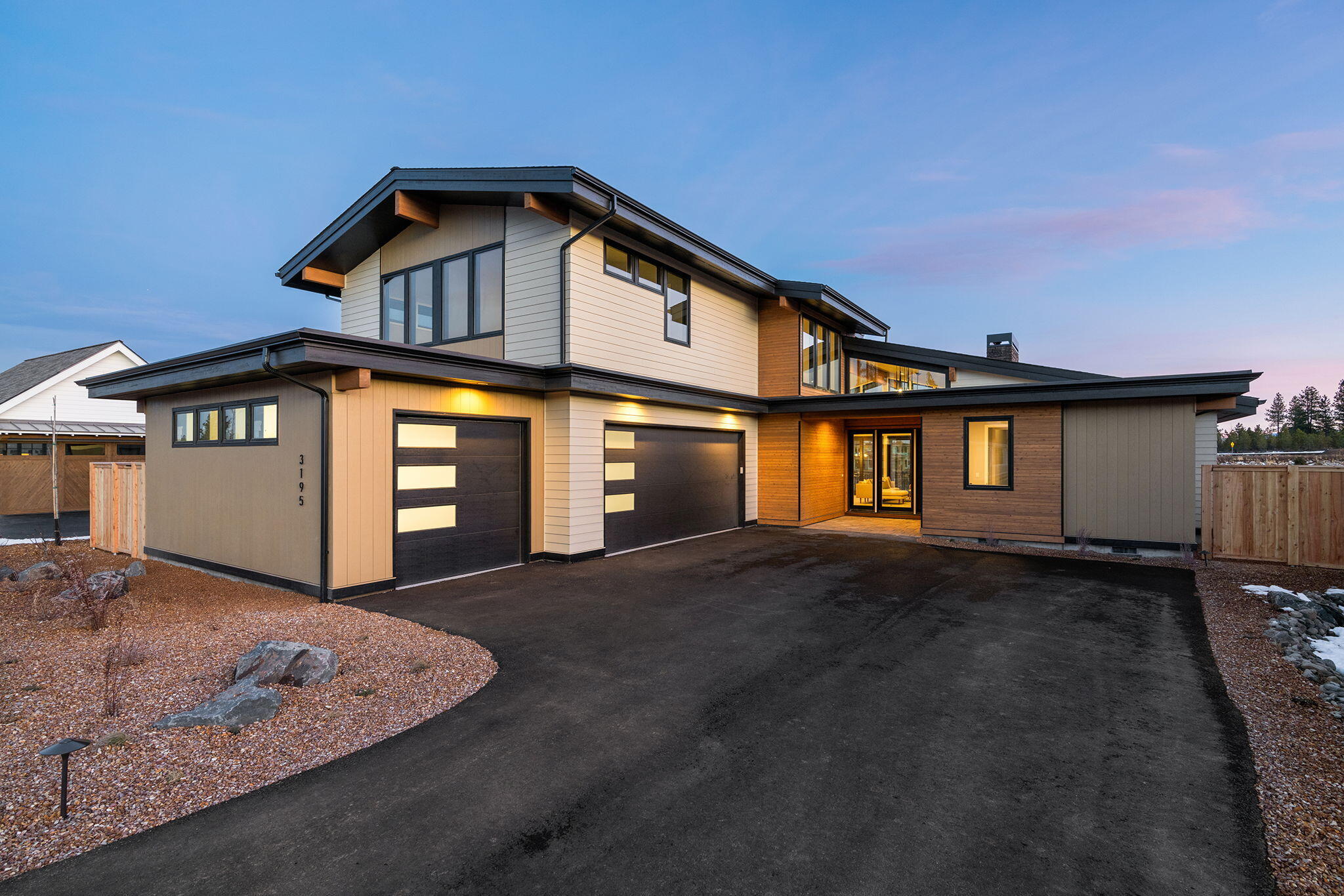 Step into this beautiful and newly constructed 3-bedroom, 2.5-bathroom home with nearly 3000 sqft of stylish living space! Nestled in a tranquil park setting, this stunning home features an office and primary bedroom on the main level for maximum convenience. As you walk through the home, you'll be enchanted by the large viewing windows which fill the space with an abundance of natural light. The well-planned open layout is perfect for entertaining or simple daily life. This home also includes a spacious 3-car garage ideal for vehicles and extra storage. The outdoor living area is enhanced by a luxurious fireplace, providing the perfect spot for cozy evenings or hosting friends. An ideal sanctuary to reside in!