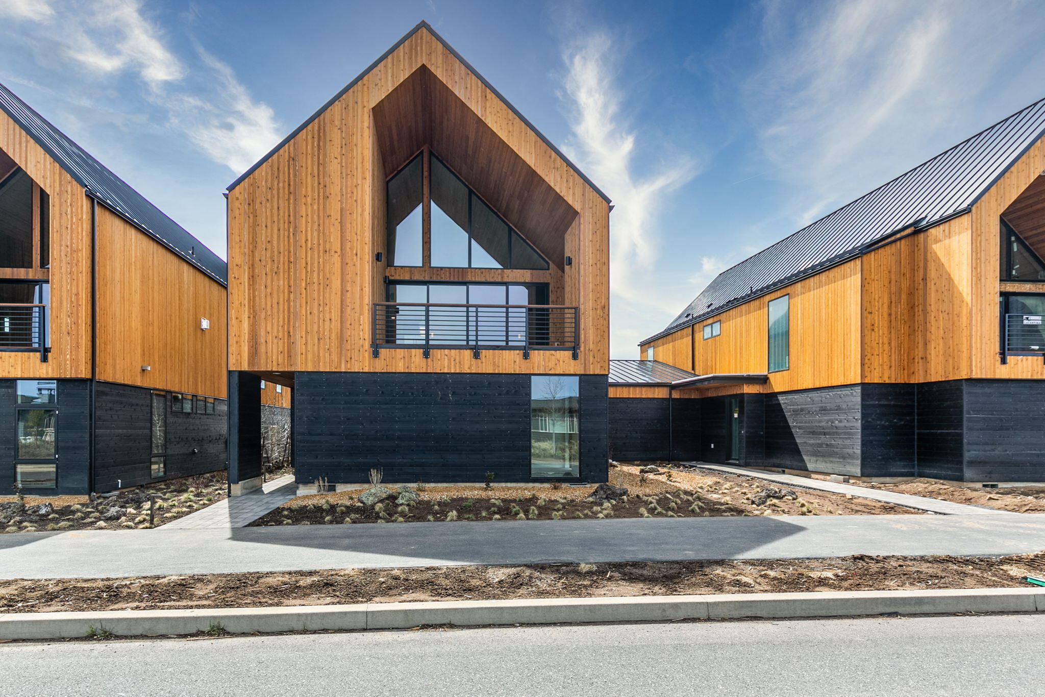 Stunning, new construction Mountain Modern townhome with unobstructed Cascade Mountain views in the sought-after community of Tetherow. Recently completed and MOVE-IN READY, this home was designed to fully-embrace Bend living. Inspired by clean lines and natural design elements, the unique reverse-living floorplan takes full advantage of views. Great Room features soaring ceilings, a natural light-filled wall of windows, contemporary fireplace, and oversized sliders opening to spacious covered deck. Cook's kitchen is an entertainer's dream, featuring solid surface countertops, professional grade Thermador appliances and an expansive working island. Private Primary Suite with dramatic windows, spa-like bath and generous walk-in closet. Entry level: 2 additional en suite BR, laundry/mudroom, and access to a FANTASTIC oversized 3-car garage. Less than 20 minutes to Mt. Bachelor, moments to the new Homeowner's pool, world-class golf, Fitness Center, restaurants, and Deschutes Trail System.