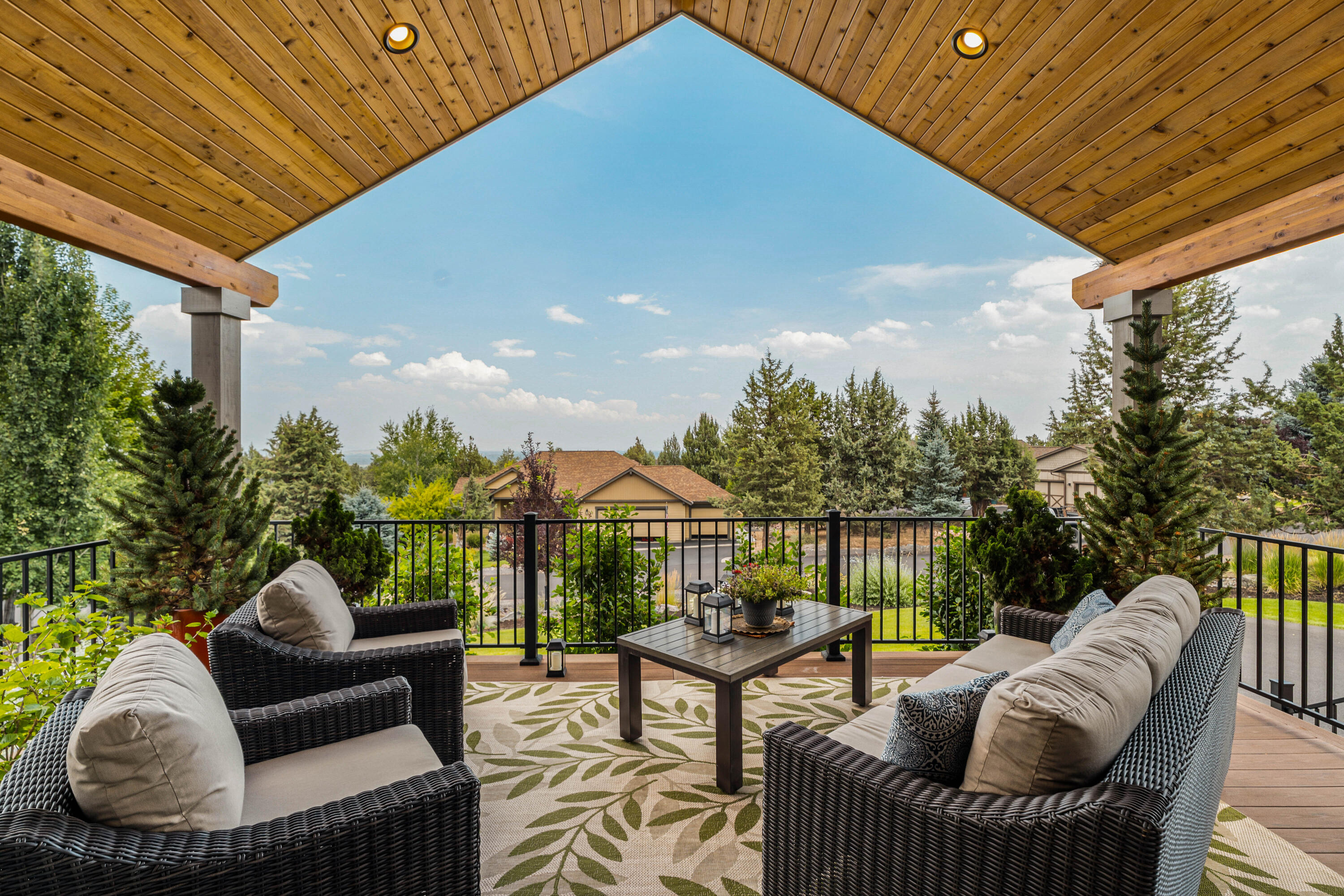Immerse yourself in the beauty of natural light and views of Smith Rock, twinkling city lights, and the Ochocos from this stunning single-level home nestled within the West Ridge enclave!  Soaring vaulted ceilings crown the expansive great room, where all eyes are drawn to the floor-to-ceiling fireplace flanked by built-ins or gaze out the wall of windows to take in the easterly views.  The chef's kitchen is a dream come true - the perfect venue for hosting friends & family.  Thoughtful bedroom separation ensures privacy and comfort, while the primary suite provides a personal haven and relaxing sanctuary.  Step outside to a serene, private back patio for morning coffee or observing the surrounding flora and fauna.  With access to scenic trails and world-class resort amenities, this home offers the perfect blend of luxury, nature, and lifestyle.  Come home to where every detail inspires, where sunlight dances across rich hardwood floors, where each space defines effortless living!