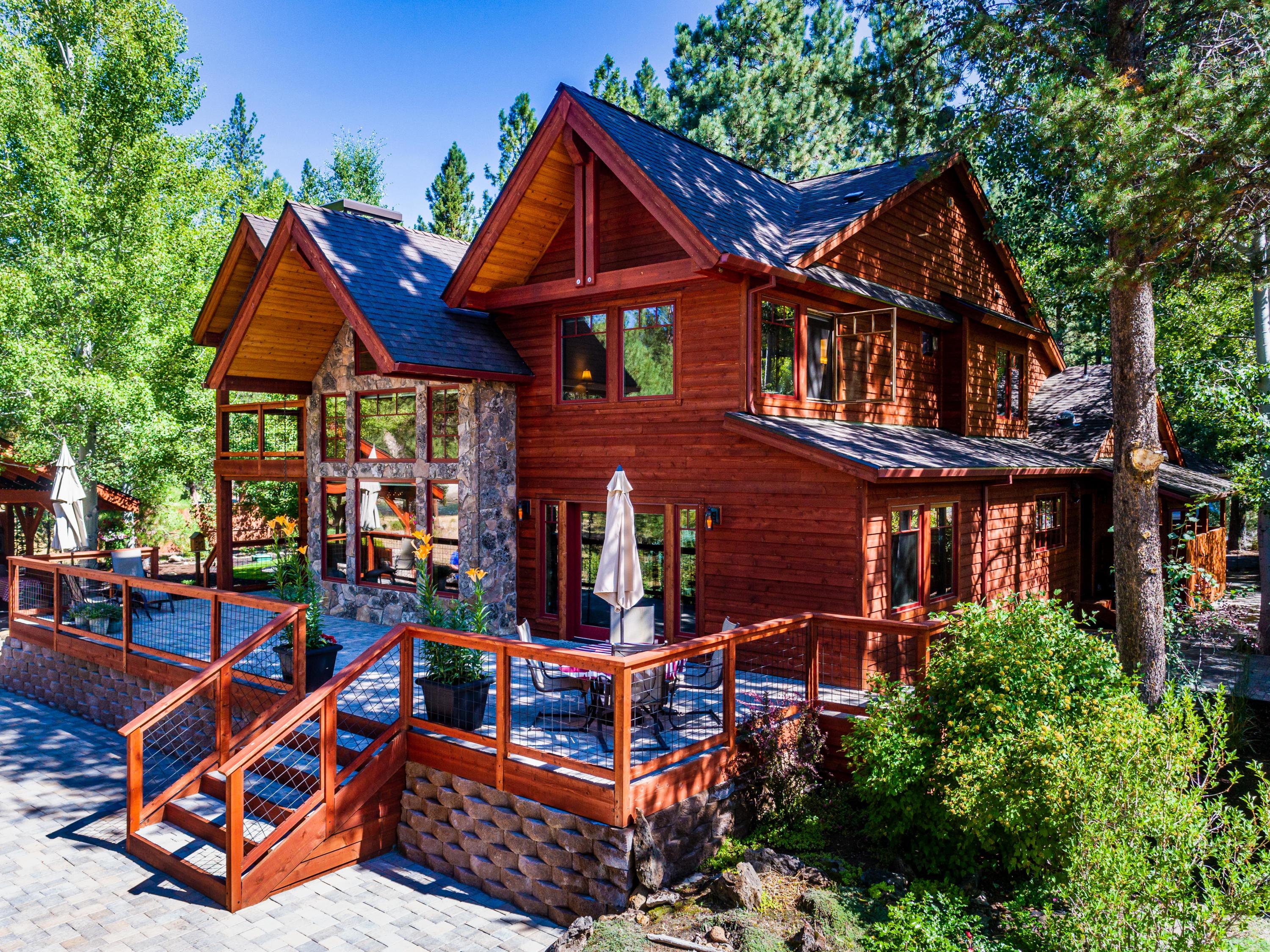 Looking for your oasis? This stunning custom home sits amongst mature trees and detailed landscaping. Enjoy entertaining in the outdoor kitchen area while listening to the Deschutes River. Relaxation at its best! No corners were cut on the details of this home. High quality windows, large wood beams, imported fixtures, hardwood floors, knotty alder cabinets and trim, Montana moss stone accents, Thermador appliances, ample storage and a beautiful one of a kind front door custom made out of 100 year old fir that welcomes you in. The master suite includes a fireplace, massive walk in closet, double multi head shower units, separate toilet room with bidet and an attached bonus room. 
Wild River neighborhood offers private river access, maintained roads, trails along the river and close to lakes, skiing and so much more. One of a kind property, must see this home that is located in a hidden gem of Central Oregon.
