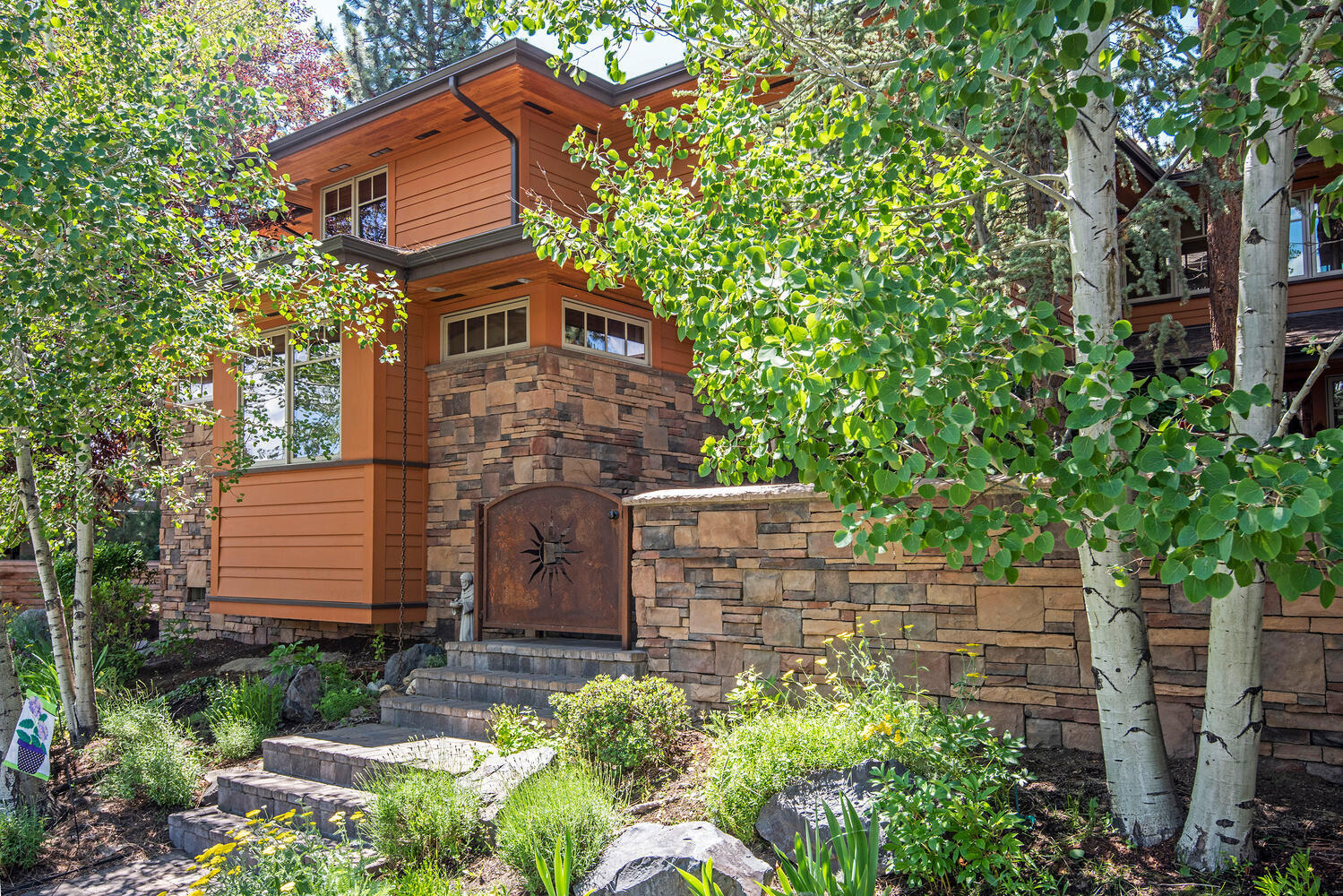 This Frank Lloyd Wright style and quality Gary Norman built home offers stone and paver gated entrance to the private courtyard with stately Pine tree.  Once inside your new castle that offers a main level master with reclaimed barn wood floors and a master bath with radiant heated tile floor, BainUltra soaking tub, spacious walk-in shower, dual vanity sinks, water closet, and walk-in closet.  The great room offers Chef's kitchen, with stone tile counters, solid surface eating bar, coffered dining area, stone surround gas fireplace and large living room finished in reclaimed barn wood. Upstairs offers built-in bookcases, storage chests, 3 large bedrooms, and a full bathroom.  What a pleasure to be able to offer this rare opportunity in NorthWest Crossing.  Private location on the corner of High Lakes Loop and Meriwether Place with convenient alley access garage.