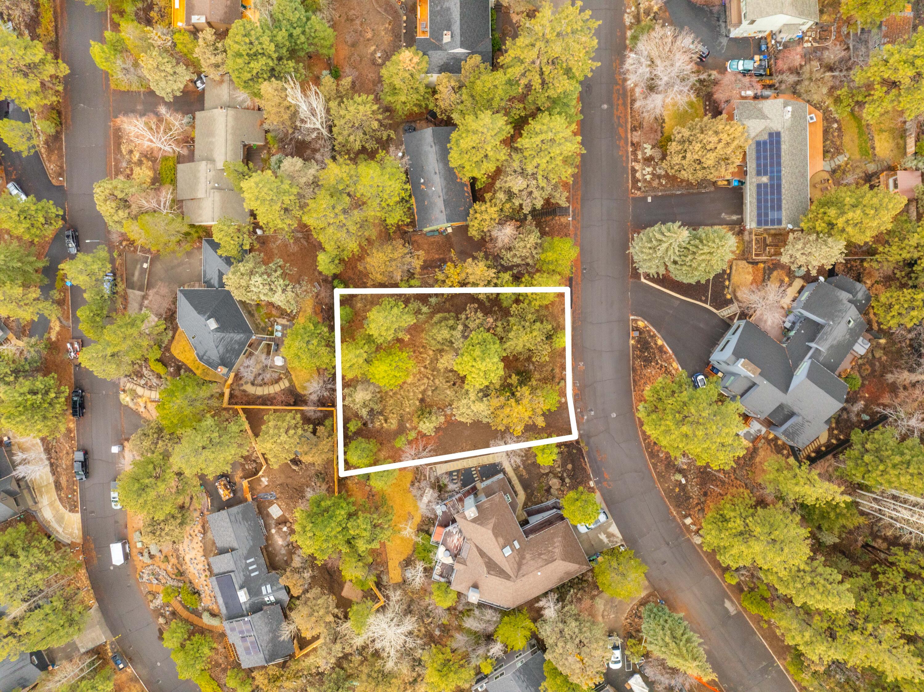 Nestled in the picturesque West Hills of Bend, Oregon, this homesite offers a stunning backdrop for crafting your dream custom home. The property is primed for construction, presenting a blank slate for buyers to realize their unique vision. Utilities are conveniently accessible at the street. The lot's south-facing orientation not only provides glimpses of Mt. Bachelor but also opens up possibilities for passive solar design, depending on the chosen layout. This is a rare chance to secure a south-facing lot in one of Bend's most sought-after neighborhoods, where vacant parcels are increasingly scarce.