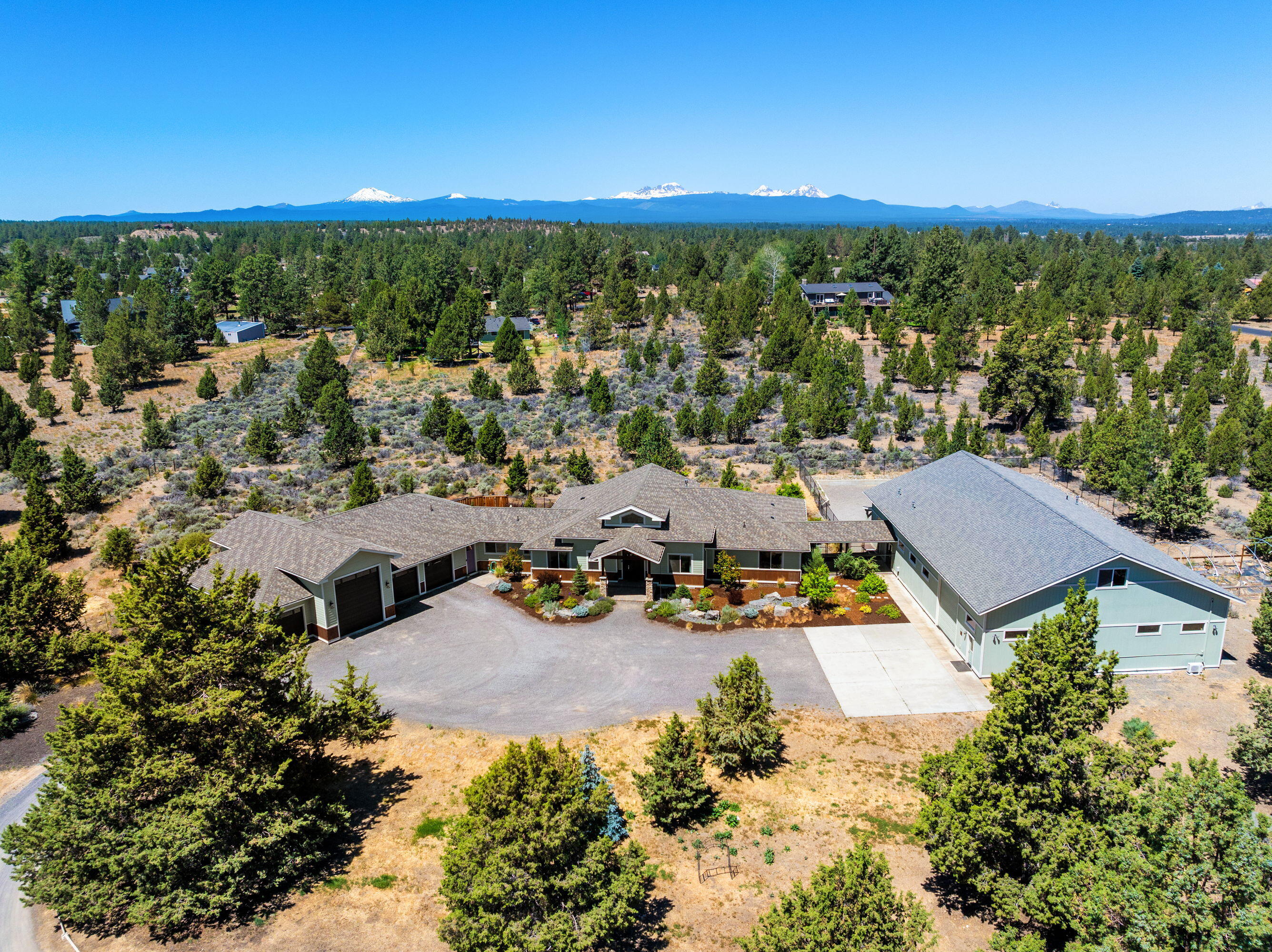 A fantastic property in Sundance on 3.27 acres. Property consists of a 3 BR, 3 BTH, 3369 sq. ft. main house, 4000 sq. ft. shop & original 3 BR, 2 BTH, 1408 sq. ft. accessory dwelling with a decommissioned kitchen. The main house is a single level home, open timber truss great room floor plan, 3 BR, 2.5 BTH, office, 10'x 25' studio, floor to ceiling stone fireplace & LVP flooring, built in 2018. Center island kitchen, quartz countertops, stainless appliances, lovely pantry. Primary bedroom offers double entry doors and walk in closets, large bathroom suite w/heated tile flooring, quartz counters, ledgestone accents, floor to ceiling double headed tile shower, 5 car attached garage (1 bay is 43' long) & 11'x 28' heated shop area & storage room above. The large 50'x 80' heated shop is partitioned with 50'x 20' shop area currently being used as a kennel w/full bath, loft area. 12' overhead door &16'x 80' finished flex space, mini split heat/ac unit above. Must see to appreciate everything