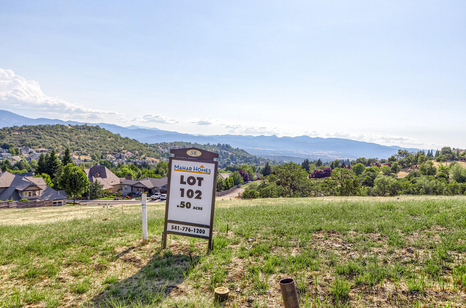 Expansive City and Valley Views!  Located in Saddle Ridge Phase 4, lot 102.  This (.51 acre) lot is in a neighborhood of premier homes located in the East Medford Hills.  This is not a build package.  You can purchase the lot and bring your own builder.  All building plans must be submitted to the Architectural Review Committee for approval prior to the start of construction.  The listing is related to the seller.
