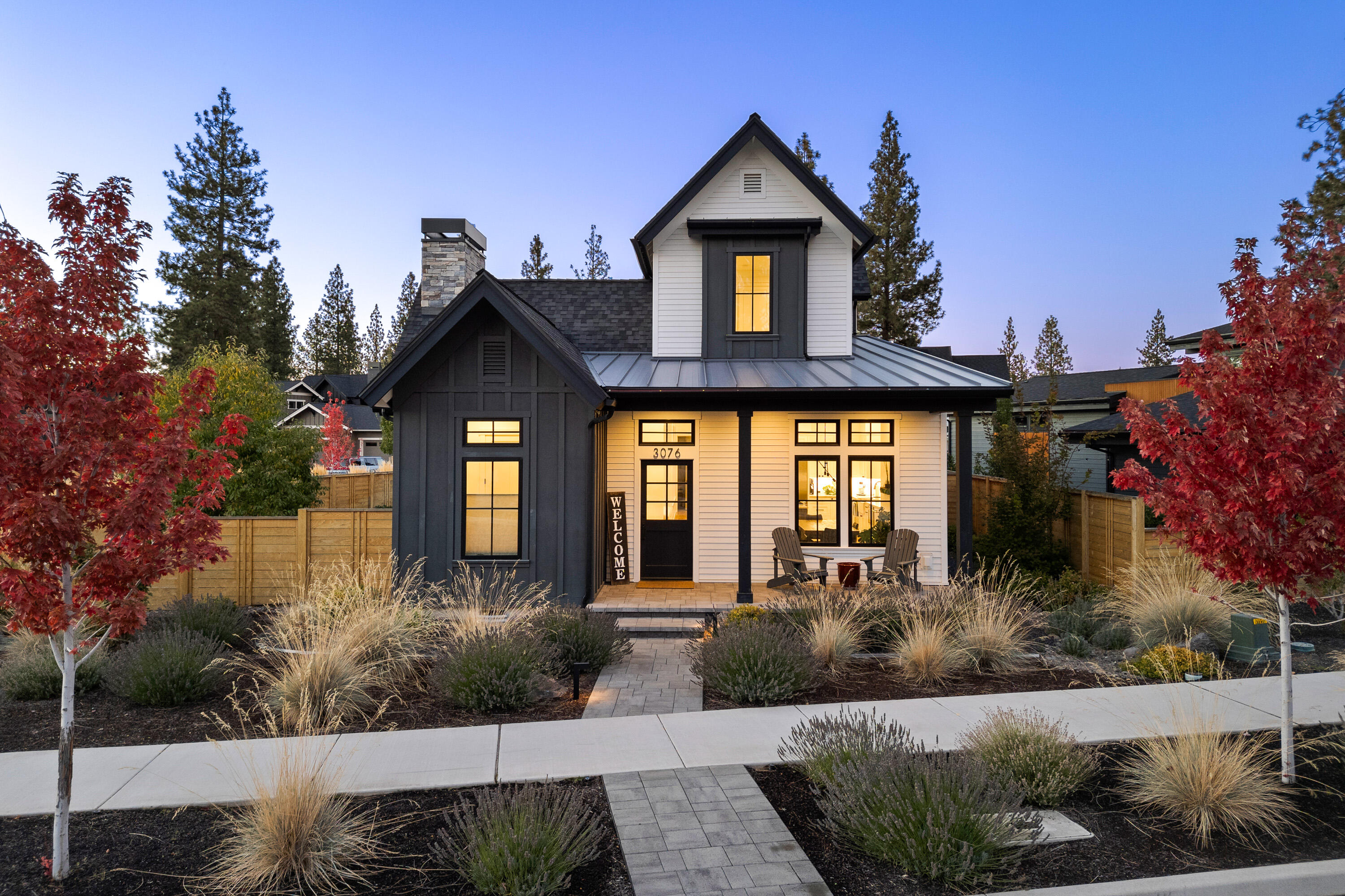This stunning 3-bedroom, 2.5-bath modern farmhouse situated on a corner lot offers an open floor plan with main-floor office, the ideal work space. Custom lighting is featured throughout the home, highlighting the large kitchen island with bar seating—perfect for casual meals or entertaining guests. The kitchen is equipped with premium Thermador appliances, including a separate ''snack'' refrigerator for added convenience. The primary suite is located downstairs & boasts vaulted ceilings with custom wood beams, providing a luxurious retreat. Upstairs two bedrooms & a full bath offer the ideal separation of space. Step outside to the private courtyard, where you'll find a custom firepit, a sunken hot tub, & a grassy area ideal for relaxation or gatherings. The oversized two-car garage has plenty of room for storage & toys. Located in the coveted Discovery West neighborhood, close to schools, trails, & shopping, making it a perfect blend of comfort, style, & convenience.