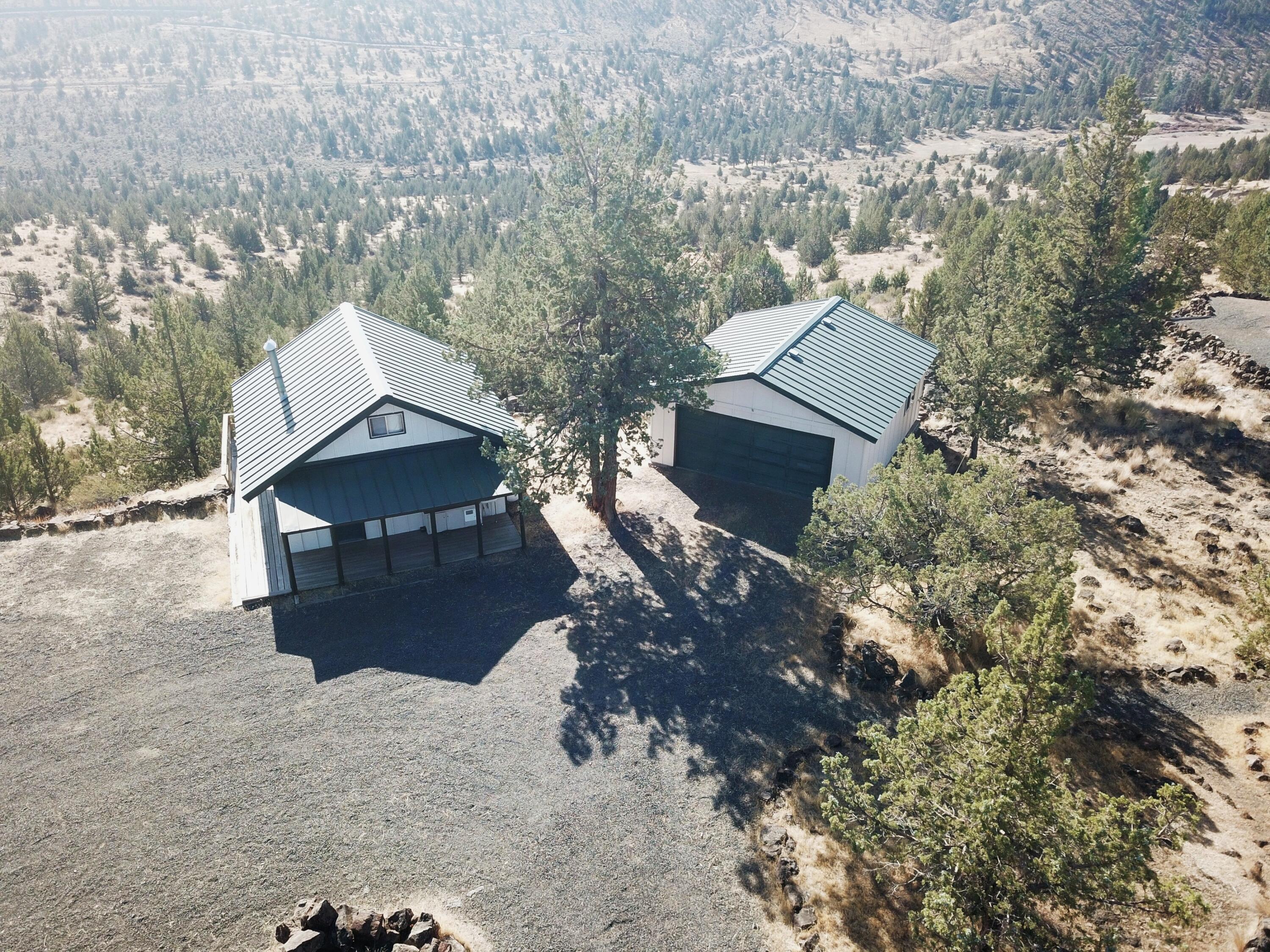 What a great opportunity to own 5.8 acres of property in 3 Rivers w/this 560 sf Cabin. Great room w/full kitchen, dining area, & living space plus 1 bedroom on the main level, & a generous loft sits above. There is a covered front porch plus a wrap around deck for those magnificent views of Big Canyon, Monkey face, & Cascade Mtns. There is a separate 22' w X 25' d garage for storing toys---it is currently partially converted to living space which could easily be removed for even more toy & vehicle/boat storage. The property also includes a ''wet'' outhouse building w/water, an RV toilet, & a stall shower w/it's own propane water heater. The huge circular driveway makes it easy to host friends & family including their RV's. Priced to sell quickly & won't last long so contact your favorite agent to book a viewing of this unique property. Property is being sold ''As Is'' w/no warranties written nor implied. Make an appointment to view.