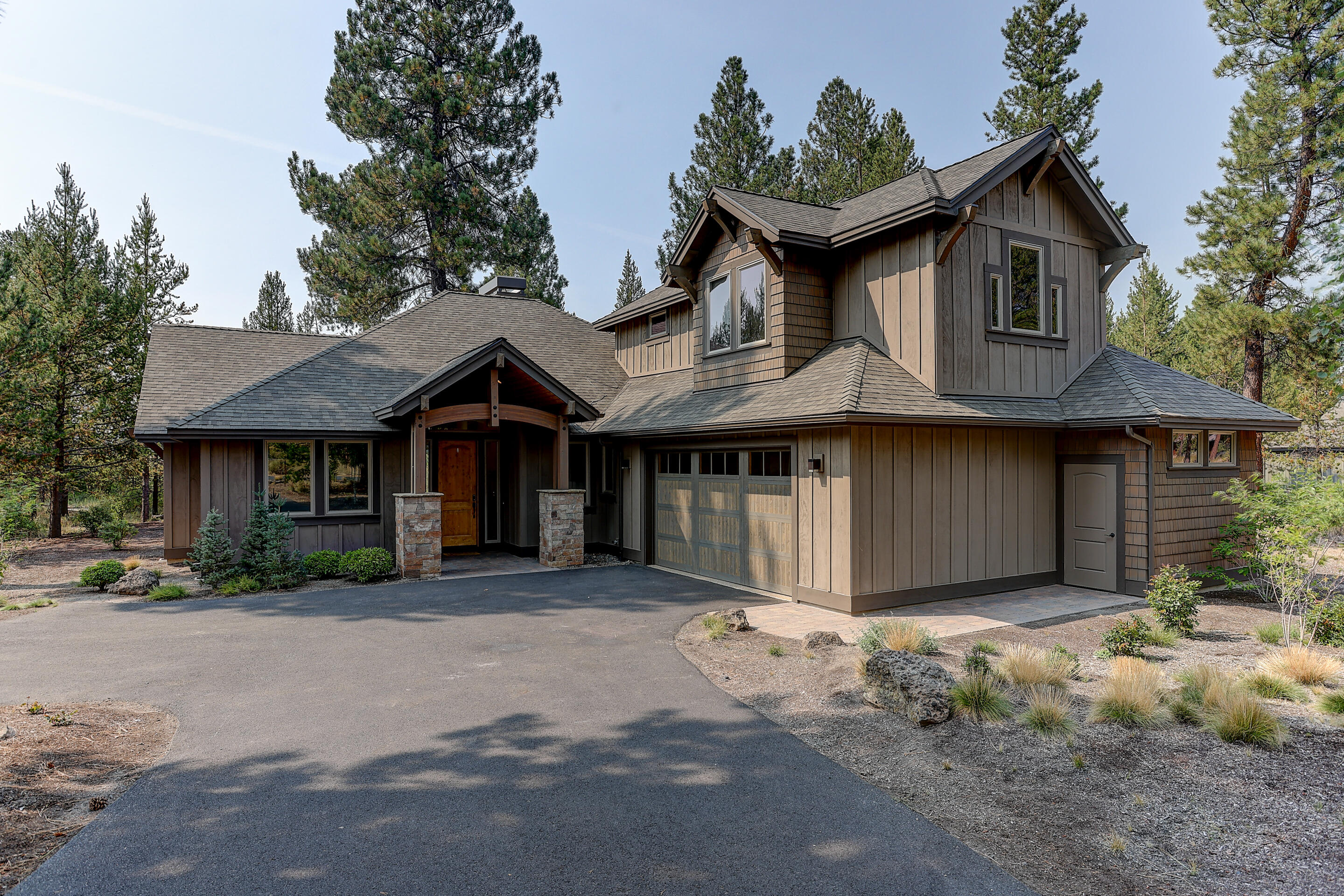 This home is the perfect place for the gathering of your family and friends to celebrate the Caldera Springs lifestyle. A spacious open and bright Great room, kitchen and dining area offer large windows for gazing at Mt Bachelor, and the abundance of wildlife in the peaceful forested setting. On the back patio enjoy the gentle sounds from the natural rock waterfall, and warmth of the firepit in the evenings. The Master bedroom on the main level has a luxurious bath with spacious tile shower and separate spa like soaking tub. The main level also has a second bedroom with private bath. Office / den is being used as a 4th bedroom. A spacious upstairs bonus room/bedroom provides added space to relax and play, and includes an alcove with built-in bunk beds with sliding barn door. Over-sized double garage with extra storage has an epoxy floor, is heated, and being utilized as a fun game-room. FULLY furnished with mountain contemporary design elements. A forest escape for adventurous spirts!