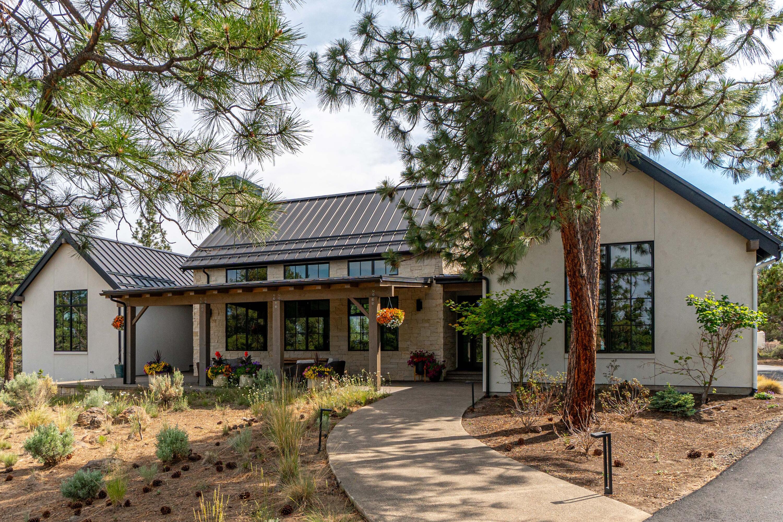 Exquisite Contemporary Farmhouse / Texas Hill-Country style home in the gated community of North Rim.  Situated at the end of a cul-de-sac on a 1.56 acre lot, this exceptional single-level residence greets you with an elevated ceiling, open concept great room and large windows capturing the natural light.  This 4 Bedroom 2 ½ bath home showcases extensive high-end updating including the custom gourmet kitchen, walnut doors & cabinetry, smart lighting, home audio, etc.  Primary suite is situated in a private wing with an elegant soaking tub and walk-in shower.  The stone facade and large inviting covered front porch welcome you like an old friend.  Huge 1,123 sqft oversized 3-car heated garage with built-in fridge.  Enjoy the blend of elegance and nature in the coveted neighborhood of North Rim on Awbrey Butte.