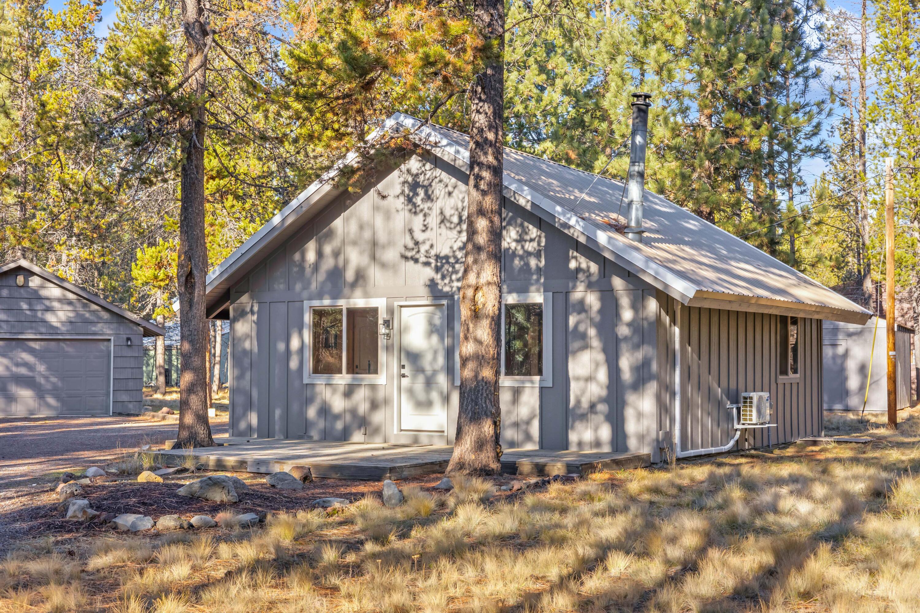 The perfect blend of 1970s soul and modern luxury! This beautifully remodeled and fully furnished cabin, offers a timeless escape on a rare, nearly 1-acre lot just minutes from the Deschutes River and Sunriver. 
Inside, enjoy a vaulted open floor plan featuring a main-level bedroom and a versatile loft—perfect as a second sleeping area or home office. The interior expertly balances cozy cabin vibes with contemporary finishes.  
Unlike typical resort properties, this property offers massive outdoor utility with ample room to store boats and trailers, and extra outbuildings great for ''toy'' storage—perfect for the outdoor enthusiast with kayaks, ATVs, skis and more.
Whether you're looking for a peaceful primary residence or a vacation retreat, this property delivers. Near world-class recreation, resort amenities, and river access. Your adventure starts here!