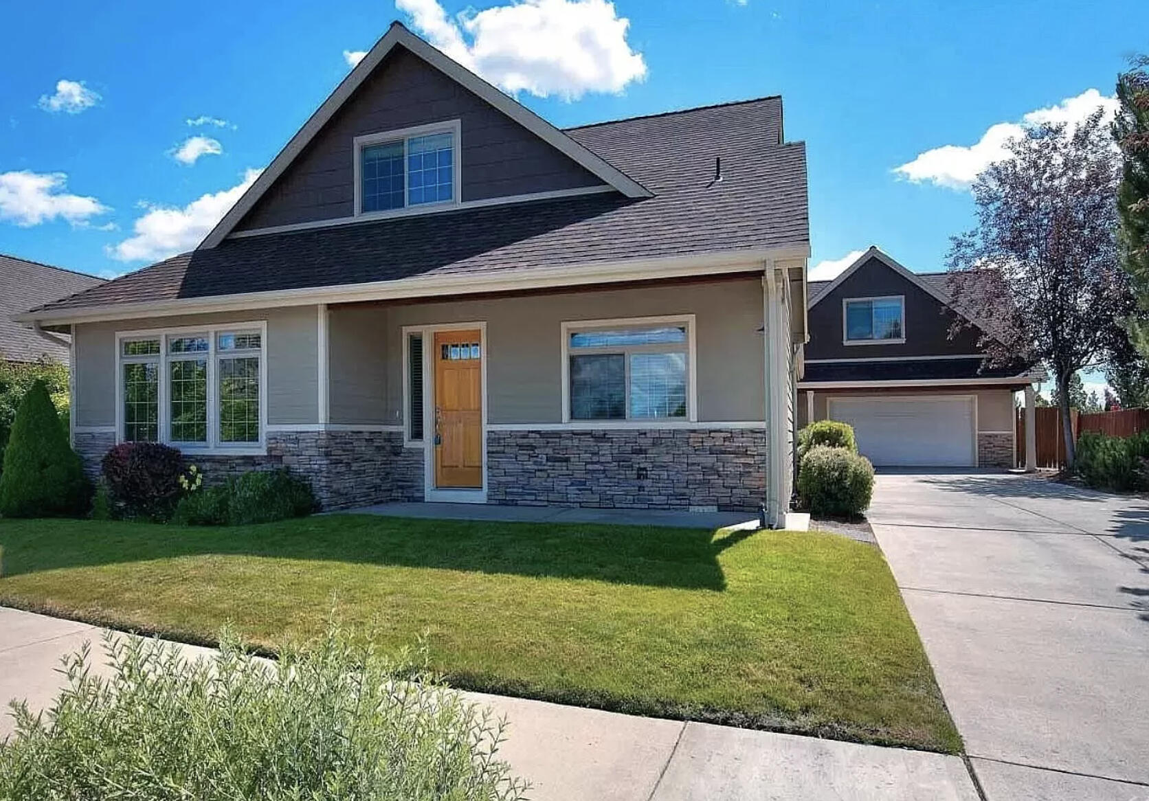 Don't miss this beautiful 1881 sf family home with an income producing, 471 sq ft licensed Short Term Rental/ADU, backing up to the 37 acre Rockridge Park! Total sq ft is 2353 and a price per sq ft of $349. The main home features a first floor Master bedroom with a spacious en-suite bath and jetted tub, first floor laundry, and an airy open layout. Enjoy stunning views of the Three Sisters from the second story. New carpet the main home pairs beautifully with gorgeous slate floors in the kitchen and dining area. 

The ADU is a 471-square-foot, one bedroom apartment over the garage with a full kitchen, AC, private keyless entry, Cascade views, plenty of storage, and a separate laundry room. The ADU has a proven track record as both a successful Airbnb and a lucrative long-term rental and is being offered fully furnished with kitchenware and basic linens, making it a turnkey rental. This is a rare opportunity to own an income producing property in a convenient and peaceful park setting