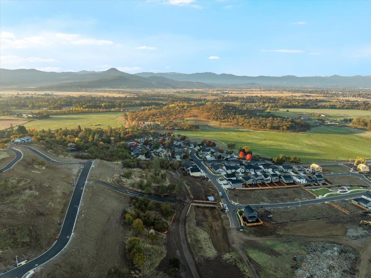 Introducing Quail Run Estates, Eagle Point's premier new subdivision of large luxury estate lots. Discover a rare opportunity to build your dream estate on one of these generous 1-acre view lots, perfectly situated overlooking the renowned Eagle Point Golf Community. These elevated home sites boast breathtaking, panoramic views of the golf course, surrounding mountains, and Rogue Valley. LOT 77