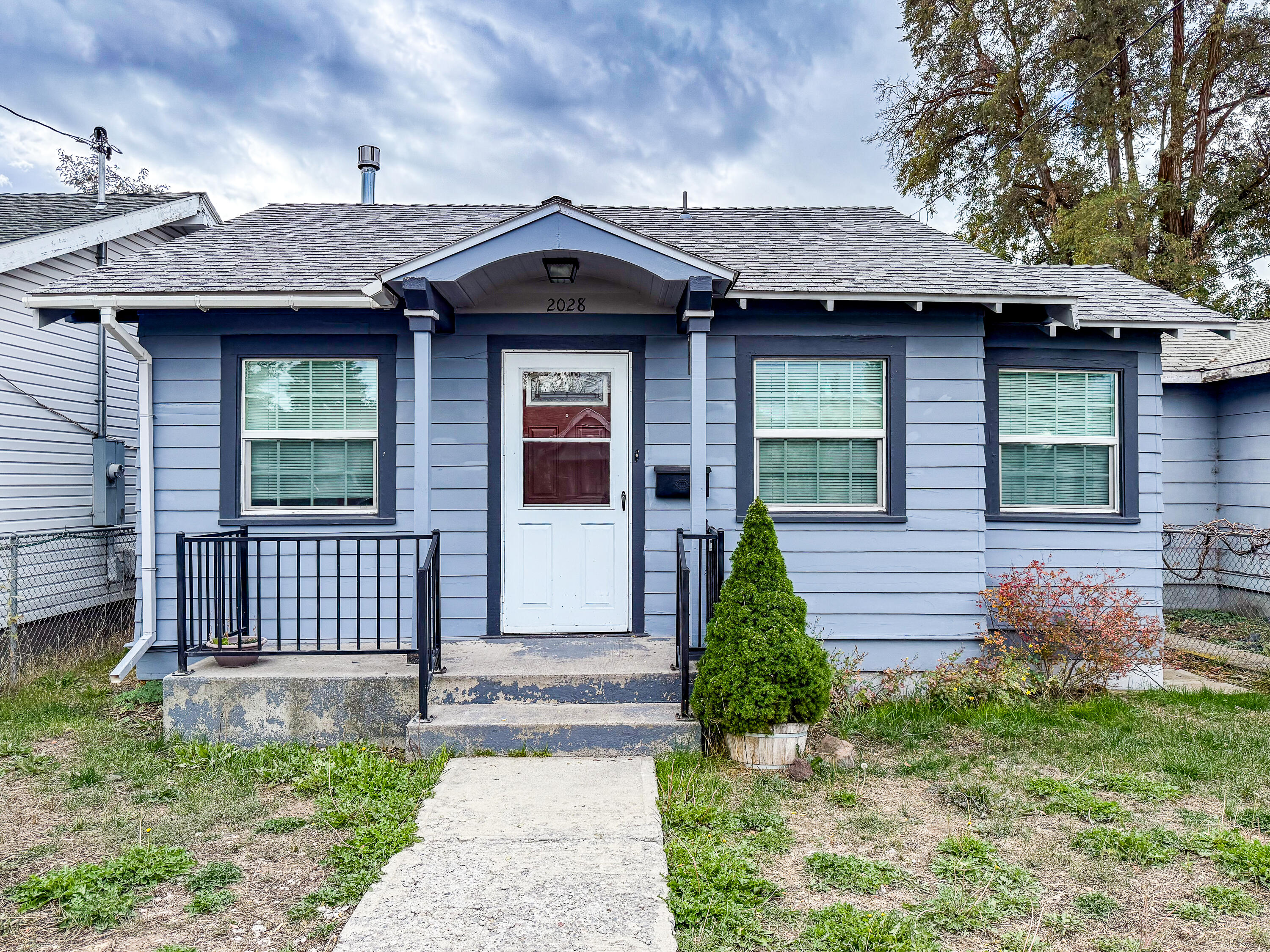 Charming and move-in ready! This recently renovated 2-bedroom, 1-bath home features fresh updates throughout, a bright living area, and a functional kitchen. Detached one car garage adds convenience and storage possibilities. Easy to maintain fenced yard perfect for BBQ's and your pets! Perfect starter home, for those looking to downsize, or investment property. Seller will consider owner carry with the right terms!