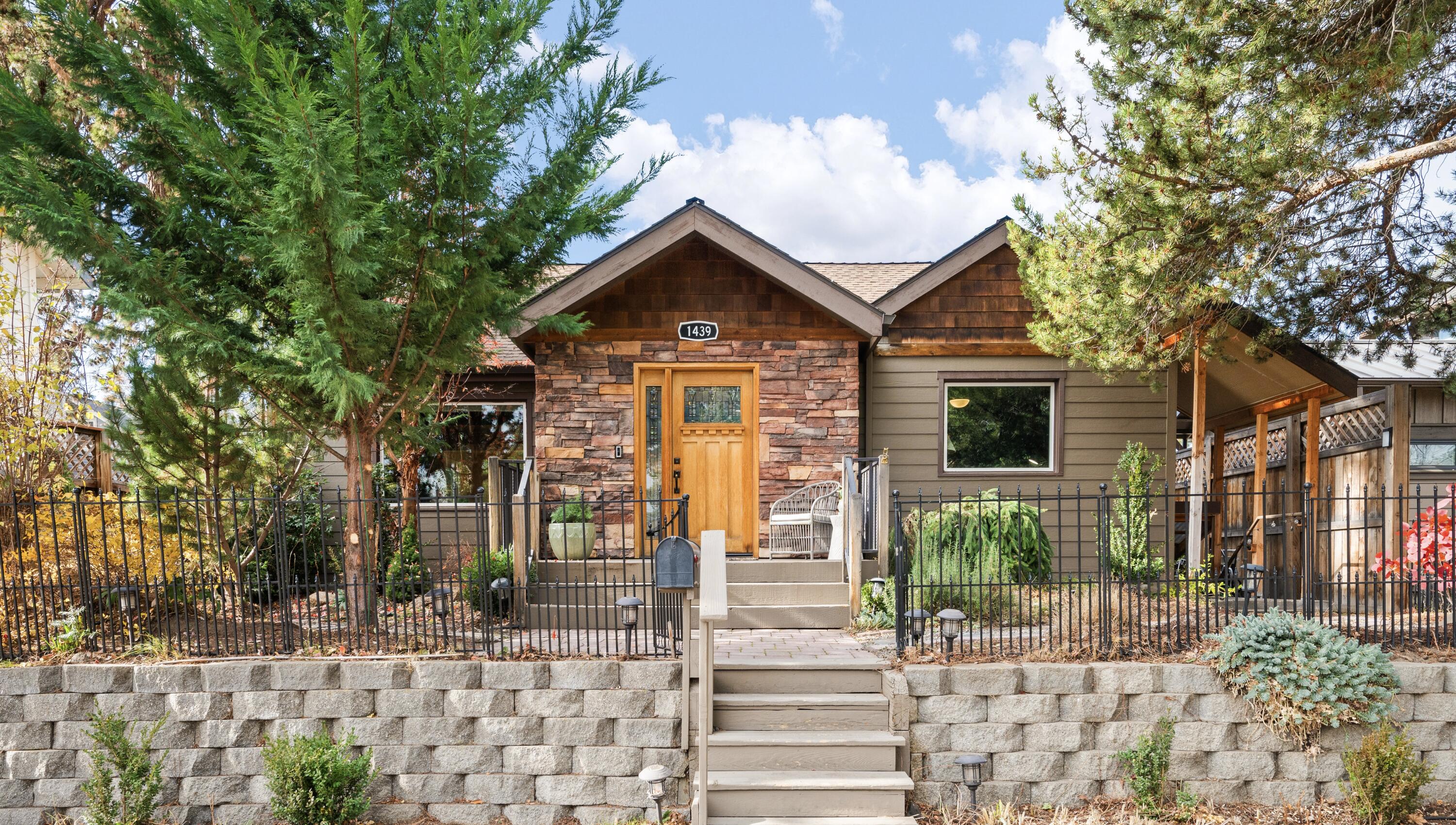 An unparalleled location offering the best of Downtown Bend living: Step out your front door & walk to Drake Park, 1st Street Rapids, Westside amenities. Situated on a peaceful cul-de-sac, this timeless Craftsman design offers 3249 SF of living space, charming character & outdoor spaces to enjoy year-round. Light-filled Living Room w/hardwood floors, vaulted ceilings, wood-burn stove & rich wood accents. Kitchen w/granite tile countertops, ample cabinetry & stainless steel appl, opens to dining area w/access out to back deck for easy entertaining. Main level Primary Suite w/walk-in closet, separate vanities, soaking tub & tile shower. 2nd BR also on main. Upstairs: loft flex space + 3rd BR/2nd BA. Finished 1,210 sf basement w/separate exterior access, 1 BR/1BA, Bonus Room, & living area w/bar and gas fireplace - INCOME POTENTIAL! Fully-fenced backyard w/deck, pergola & patio.  Detached garage + shop. A hidden treasure in one of Bend's most walkable neighborhoods
