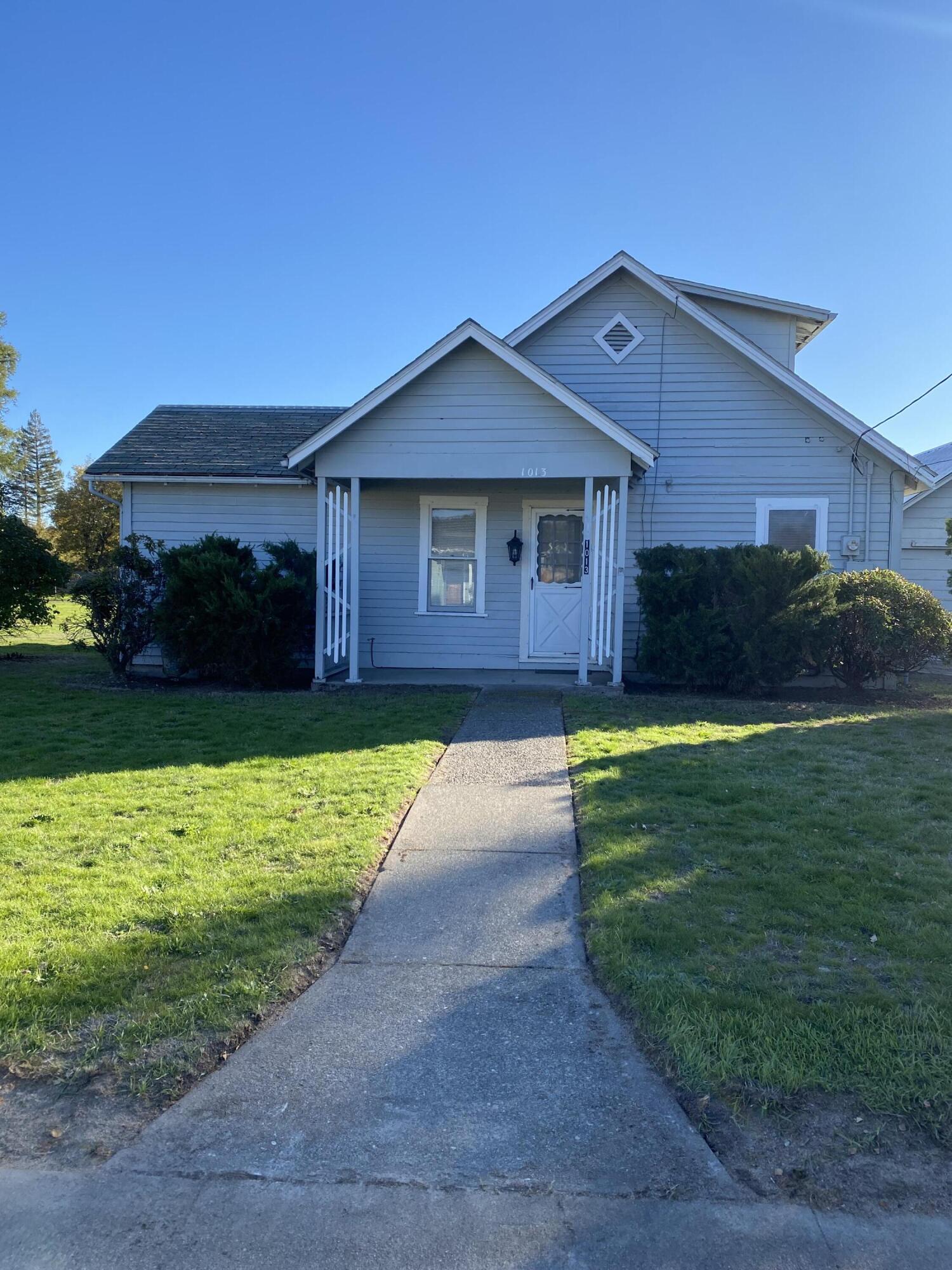 This charming two-bedroom, one-bath home offers comfort, functionality, and plenty of space for projects or hobbies. With 1,288 square feet of living area, the main level features a spacious front living room, a bright kitchen with breakfast nook, and a covered patio that opens to the backyard—perfect for relaxing or entertaining. A laundry room and large pantry add convenience, while the mudroom entry provides everyday practicality. Upstairs, you'll find a second bedroom and a bonus room for extra living space or storage.

Outside, the property includes ample off-street parking and a detached two-car garage with a large workshop—ideal for tools, toys, or creative projects. Recent updates include new flooring on the main level and plumbing improvements.

Located in southwest Grants Pass, the home offers easy access to dining, shopping, and Interstate onramps for a smooth commute while maintaining a comfortable residential setting.