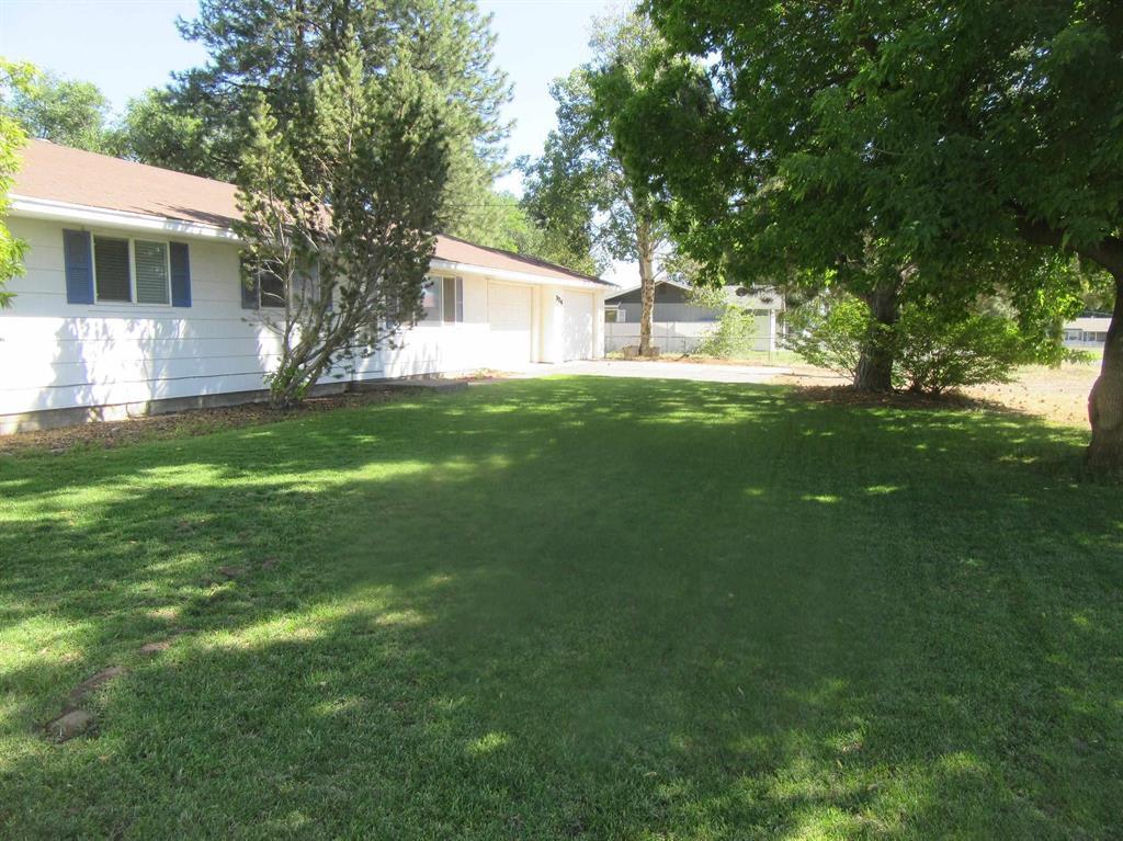 Nice Comfortable Ranch3 bedroom 1 1/2 bathroom Ranch Style  on .45 of an acre! Extra room previously used as an office/study could be 4th bedroom playroom, exercise room, etc. Well maintained with updated Kitchen & Bathroom. Has forced air oil heat. Large wide back yard with pretty green lawn, trees and landscaping. Great for pets & entertaining. Attached 2 car garage has paved driveway. Lot to right of garage has double wide gate that opens for parking RV or boat inside fenced area. Seller will give a $500 credit at closing towards closet doors and blinds.  CA DRE 02066457/FNR CA DRE 02074761