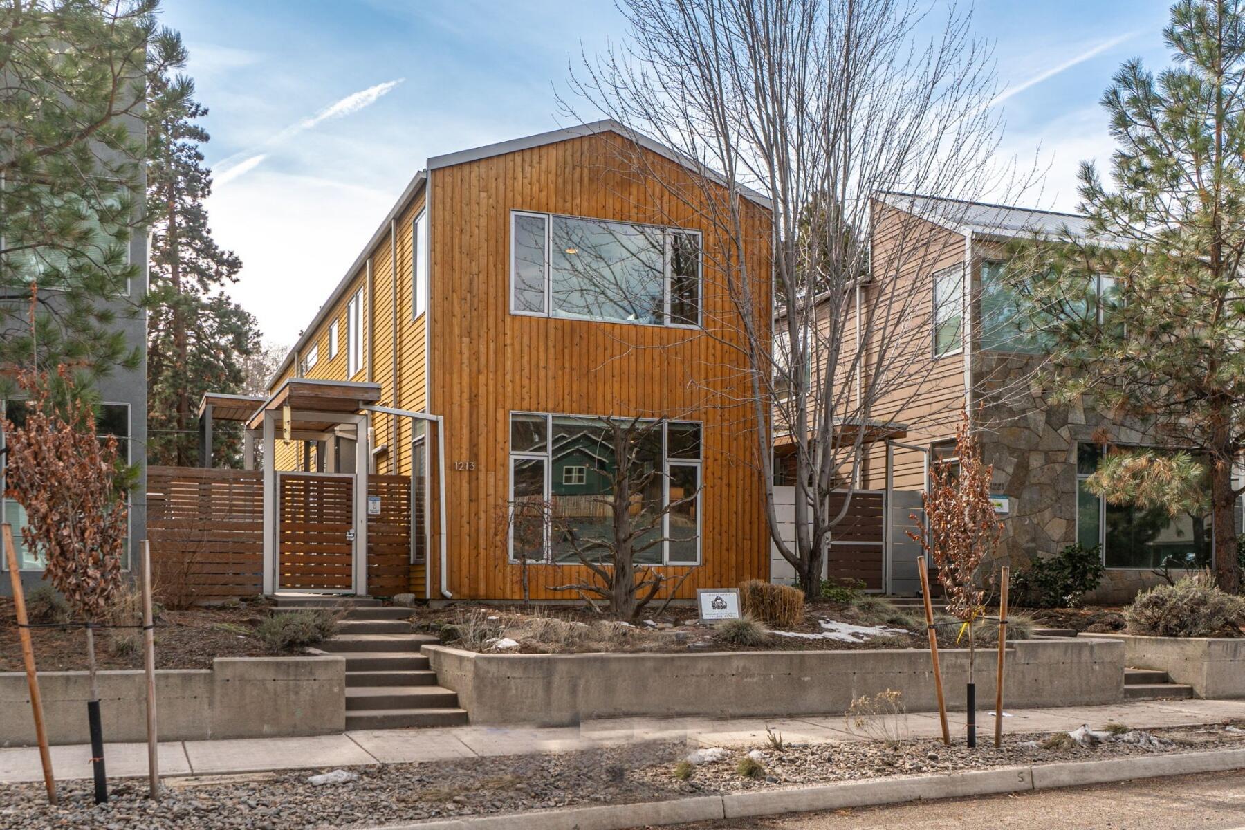 Enjoy this Fully Furnished Grandfathered Short Term Rental in the heart of Bend's Westside! The location of this home is moments from shopping, restaurants, parks and bike trails right outside your front door. This home features radiant heated concrete floors, solid wood doors, gas appliances & fireplace. You will find the Kitchen & Living spaces allow for endless opportunities to entertain. The second floor Primary allows for tree top living with a private patio and boasting a very generously sized bathroom including a soaking tub with cheerful subway tiles in the bathroom. The side yard landscaping has turf grass, a BBQ area, along with built -in seating which is a delight for year round use. The home has a proven two year record of $86K-$90k+ annual gross income! This would be an easy transition for a new investor to take over this fantastic property. Call today for a private tour!