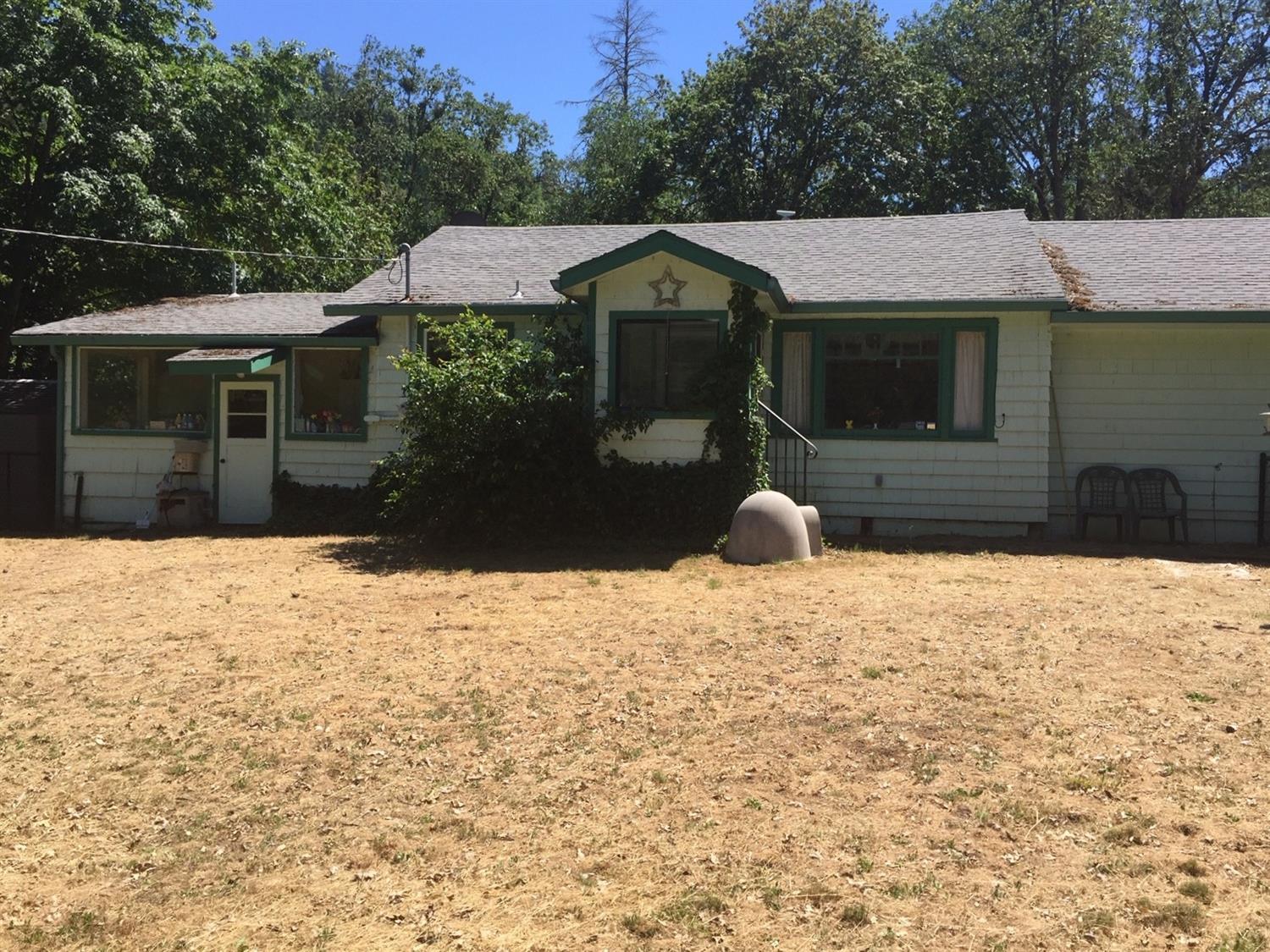 Applegate River, Jackson Creek Frontage! 7 acres of wonderful land off Fish Hatchery for all the possibilities you can imagine. Owners ran a pet boarding and grooming business, kennels are still on the property along with all the wonderful black chain link fencing and gates. This property has lots of wonderful features including a fenced off 14ft in ground pool with a pool building. Lots of deferred maintenance but per owner, the roof was done not long ago. This is a wonderful area to raise a family and or raise your favorite critters. The home is currently spring fed dating back over 100 years and never had any problems. The owner will be relocating and will need time to get situated and move all the family items. All information deemed accurate, buyers to perform their own due diligence.