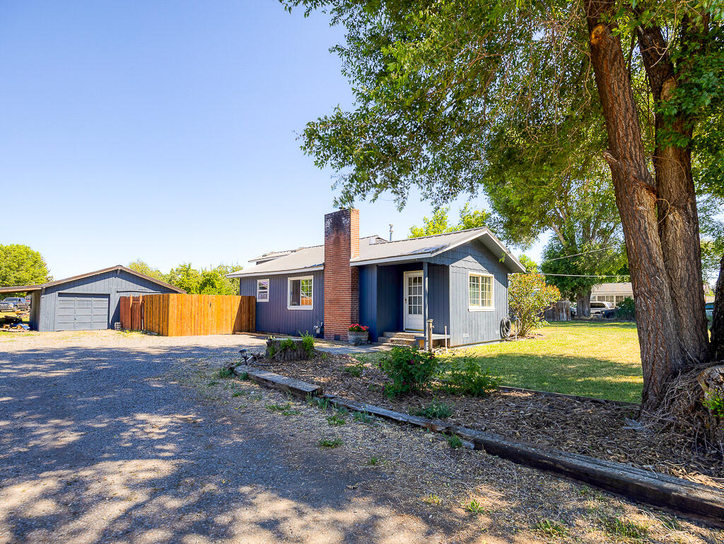 Welcome to this charming 3-bedroom, 2-bath home nestled on a full acre right in the heart of town! This property offers the best of both worlds—convenient location with a spacious country feel. The primary suite features a large jetted soaking tub, walk-in shower, and plenty of space to relax and unwind.

One of the bedrooms includes access to a finished bonus space with LVP flooring and its own closet, perfect for a home office, craft room, playroom, or extra storage—endless potential to fit your lifestyle needs.

Enjoy peace of mind with a new metal roof, plus fresh interior and exterior paint that gives the home a clean, updated feel. The yard is set up with a full sprinkler system, and there's plenty of room for gardening, hobbies, or space for your animals to roam.

Opportunities like this don't come up often—don't miss your chance to make it yours!