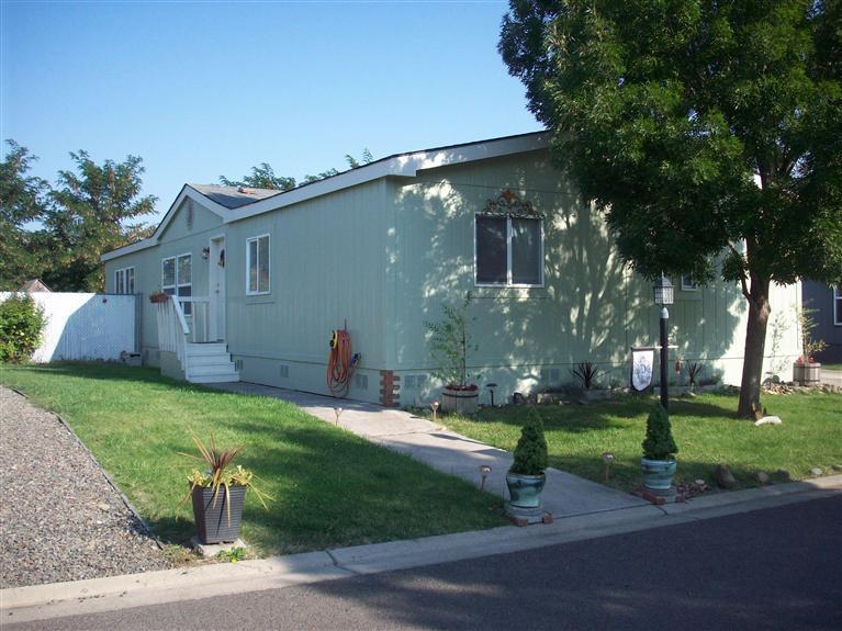 Amazing describes this completely remodeled 4 bedroom, 2 1/2 bath split floor plan home. Brand new kitchen with bamboo hardwood floors, stainless steel appliances including sink and refrigerator, granite countertops. New 1/2 bath added . Other baths redone including ceramic title,basins. All new floor coverings , designer lighting thru out. Interior walls textured and painted. Exterior painted. Too many extras to list. Private back yard with koi pond. Storage unit, Park has nice clubhouse, additional parking for guests. You will fall in love and recognize the top quality and tasteful remodel that has gone into this home.