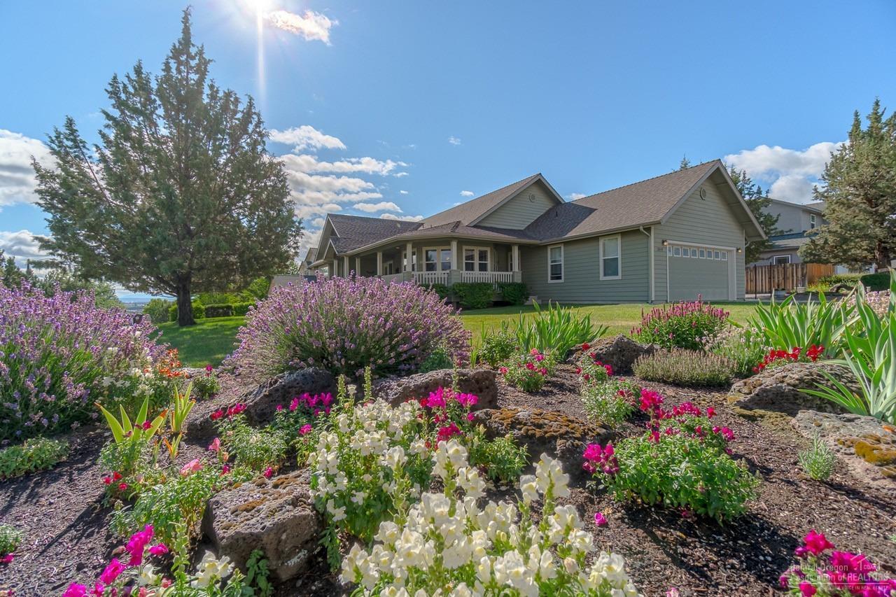 A very gently used custom home on a large corner lot in sought after Cascade View Estates, This single level Contemporary Ranch home has a wrap around deck in front and back of home. A very spacious breakfast nook with bay windows. Custom Hickory cabinets throughout home and walk in closets in every bedroom. The living room boasts vaulted ceilings and a cozy gas fireplace and mantle. The outside is nicely landscaped with a custom stamped patio in the backyard.Master bedroom access to back deck.