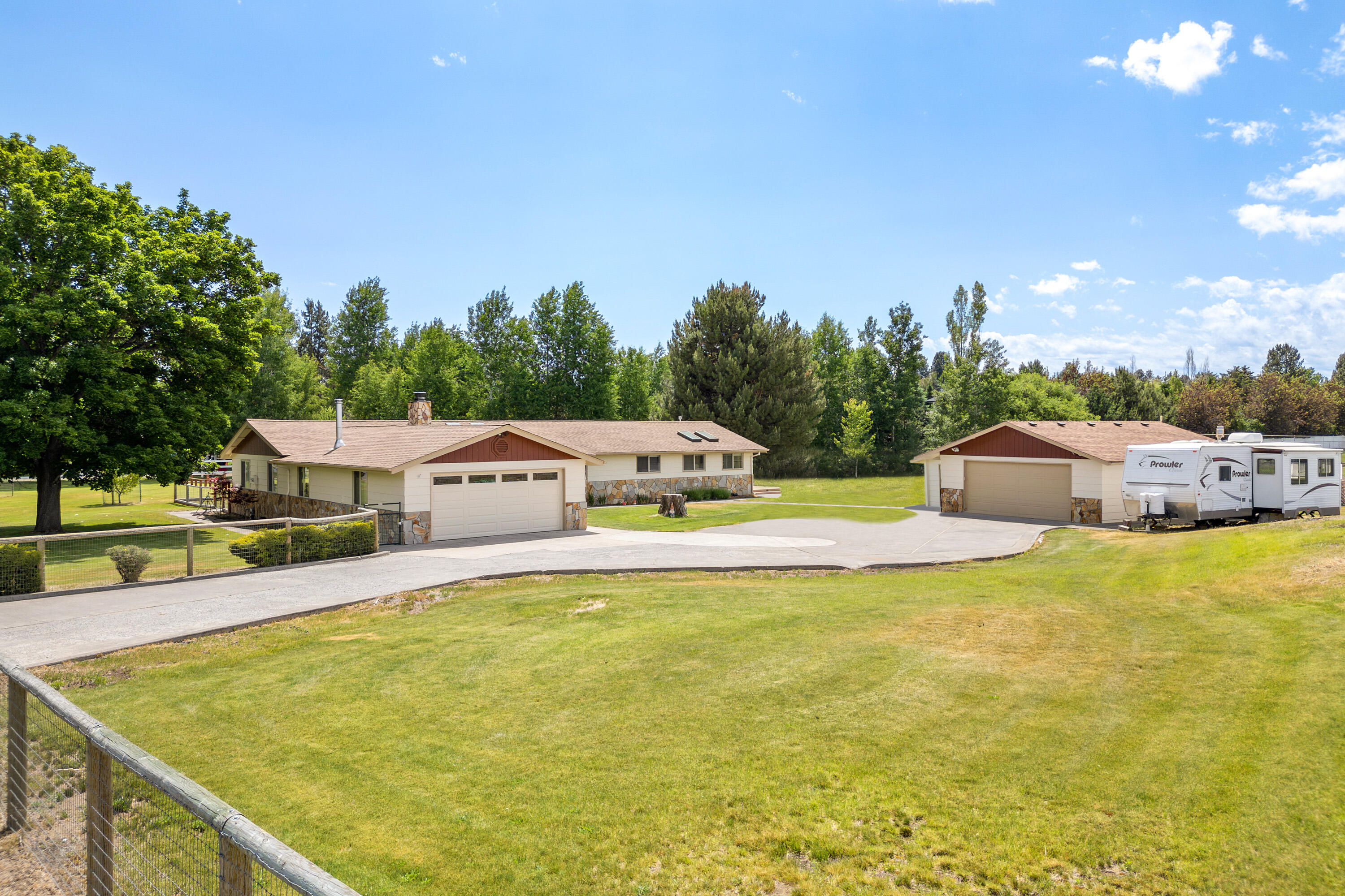 This single-level home nestled on a sprawling 1.24-acre lot in the coveted Dobbin Acres has it all. Step inside to discover a fully remodeled chef's kitchen, complete with a massive island & double oven, perfect for hosting gatherings. The bathrooms have all been tastefully remodeled, ensuring a contemporary feel throughout the home. This home has two fireplaces, one in the living room & another in the bonus room, perfect for those chilly nights. Relax on either of the two new Trex decks (one covered) perfect for evening BBQ's.  Don't miss the two double garages, one attached to the house & another detached, which includes a shop for your projects & hobbies. Additionally, there's a storage shed, a lean-to, a greenhouse & a tennis court that can be resurfaced or transformed into pickleball courts, providing endless opportunities for outdoor activities & entertainment. This residence in Dobbin Acres is truly a gem, offering a blend of comfort, functionality, & recreational possibilities