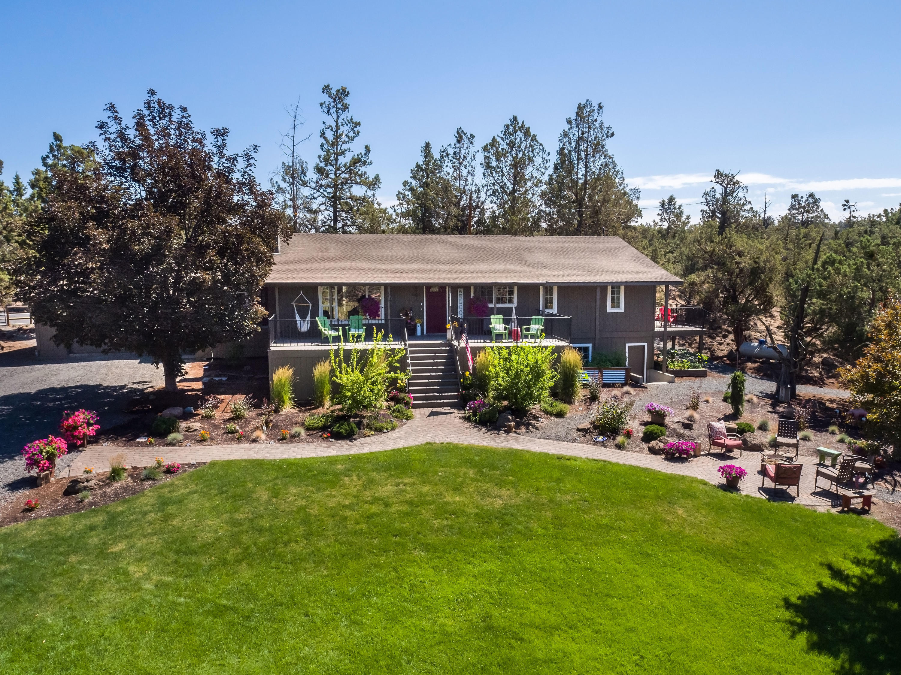 Tumalo Acreage with two legal dwellings, irrigated pastures, shop and a parklike setting. Country home is 2589 sf, 4 bedrooms, 3 bathrooms, office, family room, gym, 2 car garage. Home and property are well maintained with landscaped yard, garden area, fenced backyard, fire pit and park like setting. Second/Guest home is a newer single level 2 bed, 2 bath 917 sq. ft., separate from main home with own entrance. Insulated shop with office and storage. Property is 6.78 acres with 2.7 acres of irrigation with K-line system and pond. Pastures are fenced with livestock shelters and property borders public land. Terrific opportunity for horses/livestock, with two homes on acreage close to Bend and Sisters!