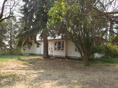 71.15 Acres of beautiful farm land. The house is a 3 bedroom 1 bath. Built in 1916 with some repairs needed.  The manufactured home is also older with some repairs needed. 2 bedroom 1 bath. The property is irrigated by KID. Pumps and Pipes not included. Large Hay Barn and many out buildings. Horse/Cow corral and chicken coop. Mobile has been winterized. 
 Buyer and buyers agent should do there own due diligence.