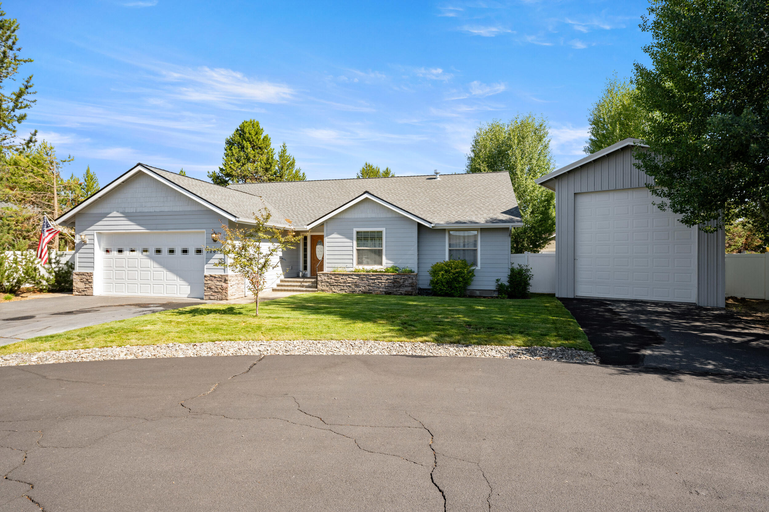 Charming Custom Perry Walters home in La Pine City Limits! Welcome to this rare & beautifully maintained 3 bedroom home w/attached garage & 35 ft Shop perfectly situated within La Pine. Offering exceptional comfort & thoughtful upgrades. The exterior boasts fresh exterior paint w/new porch & handrails.  Inside discover an inviting layout. Throughout the home you'll find laminate flooring & w/carpeting in each spacious bedroom.  The heart of the home is in the kitchen designed for convenience.  Enjoy a new Maytag refrigerator and stove, sparkling backsplash and ample cabinetry with some pull out shelves for easy access.  Pantry offers storage. Gas Fireplace in the Living Room will help keep you warm on cold winter nights! All 3 bedrooms are generously sized, featuring large closets.  The primary suite offers a walk-in closet outfitted with shelves & private door to covered back deck. Linen closet in hallway & solid wood doors.  Nicely landscaped, fenced yard w/path to shop.