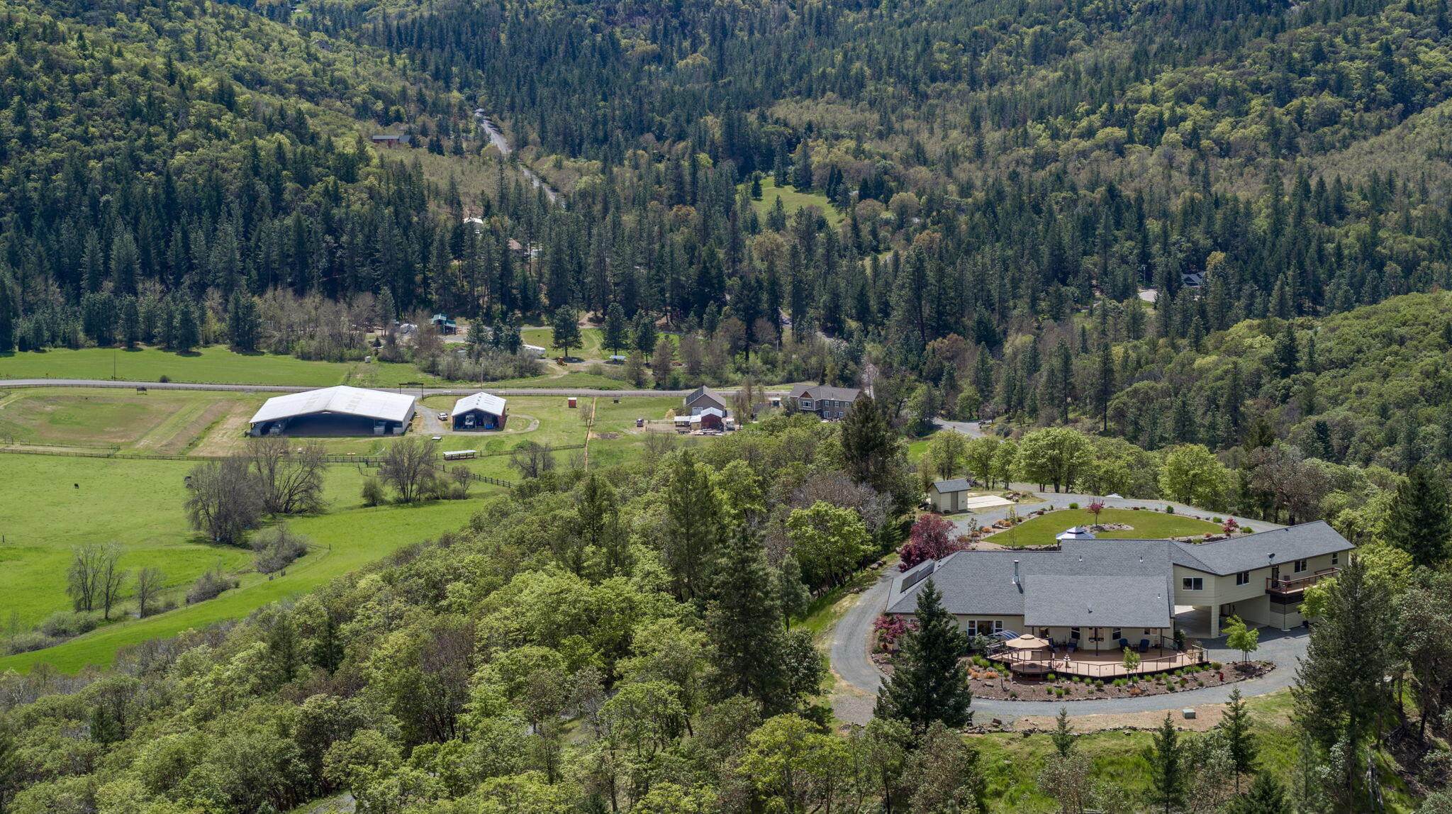 This sprawling estate spans 89+ acres of pristine land with 18 irrigated acres, offering stunning 360-degree views. The centerpiece is a lavish 5938 square foot home with a three car garage and covered carport. 

Inside, high end finishes and an open floorplan create a luxurious ambiance including new appliances, oak flooring, new carpet & new roof. The main level features the primary bedroom, two additional bedrooms, an office, and living space, while upstairs, a spacious entertaining area leads to a self-contained fourth bedroom with a separate entrance, a perfect guest retreat or potential rental.

Outside, a 5000 square foot shop/ag building with full bath, caters to various needs, complemented by an exceptional covered arena with 34 stalls, tack room, and washroom, ideal for equestrian enthusiasts. 

Other amenities a covered patio, fire-pit, gazebo, owned solar, an RV hookup, and fuel reduction/tree clearing.

OWC. Call for info!
