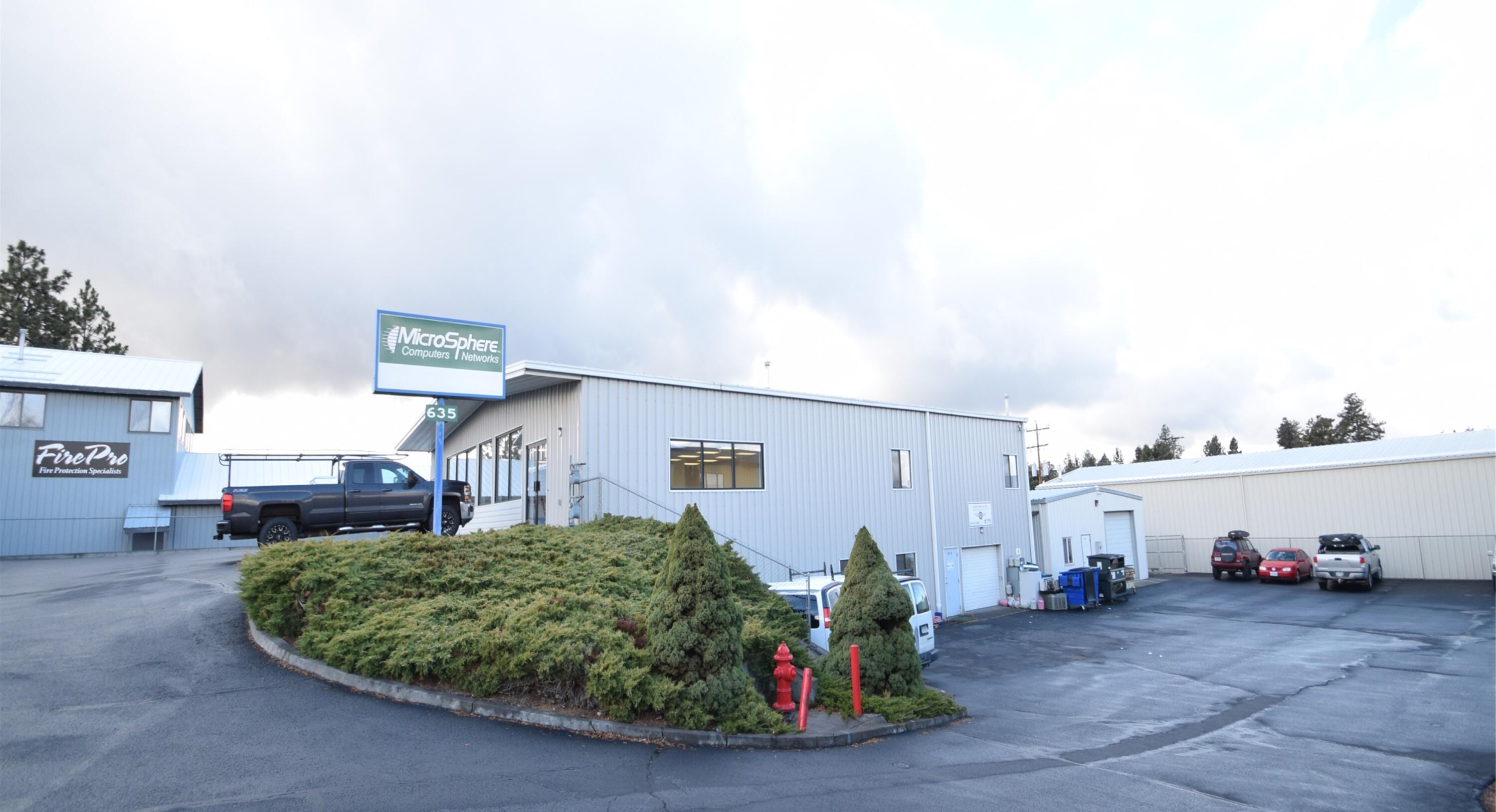 Standard Sale Conditions-New Owner can occupy 100% of the property. Owner/User or choice Investment property in SE Bend, just off Wilson Avenue located in the Wilson Avenue Business & Industrial Park in Bend, OR. Perfect for the Service Industry User! Move-in ready showroom/offices/warehouse building built in 1994 with auxiliary shop building constructed in 1999 behind the main building (west). 9,000 +/-RSF main building with 2,100+/- RSF shop building (11,100+/- total SF). Main building has glass storefront retail doors that open to showroom area, two (2) offices and two (2) restrooms (One with shower). Lower-level in main building has three (3) offices and two (2) restrooms w/One (1) 8' roll-up door-One (1) 10' roll-up door on shop building.  Seven (7) dedicated upper parking spaces in front of main building with large paved parking area on lower level to the northside of building and by shop building.  CLA for more info.