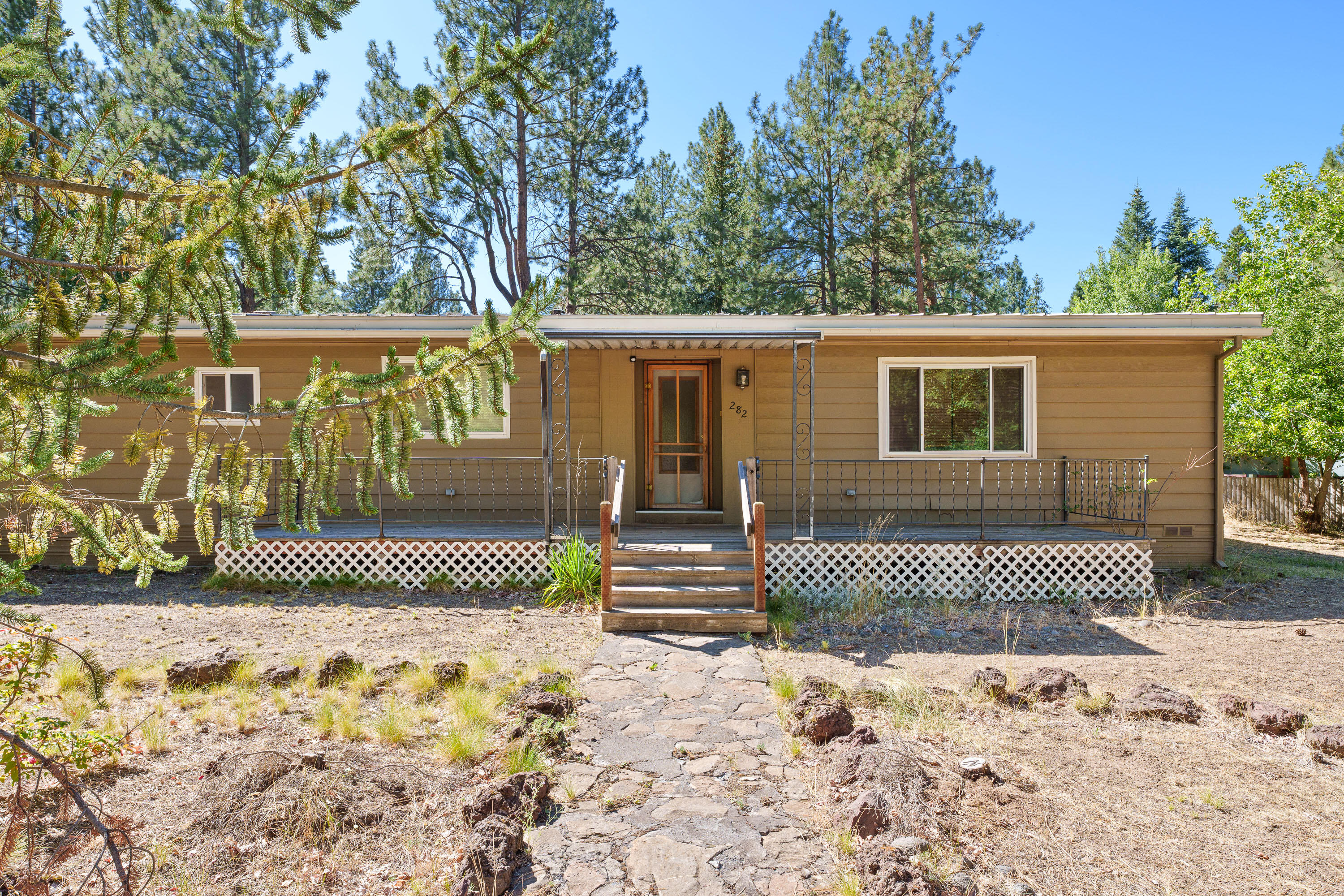 This charming three-bedroom, two-bath manufactured home sits on nearly a third of an acre, right across from Wychhus Creek. It's just steps away from the Peterson Ridge Trail system and within walking distance to downtown Sisters. This property offers numerous possibilities, making it an excellent investment, a second home, or a primary residence. Recent updates include a new heat pump, a new pellet stove, a new roof on the garage, an upgraded electrical panel, and updated plumbing in the bathrooms and kitchen. Additionally, there's an EV car charger on the garage.  Included in the purchase price are a new refrigerator, washer/dryer & TV with mount! All of this is conveniently located near schools, shopping, and dining. The property is spacious enough to be partitioned into two lots, though buyers should conduct their own due diligence on this option. Call for your showing today!