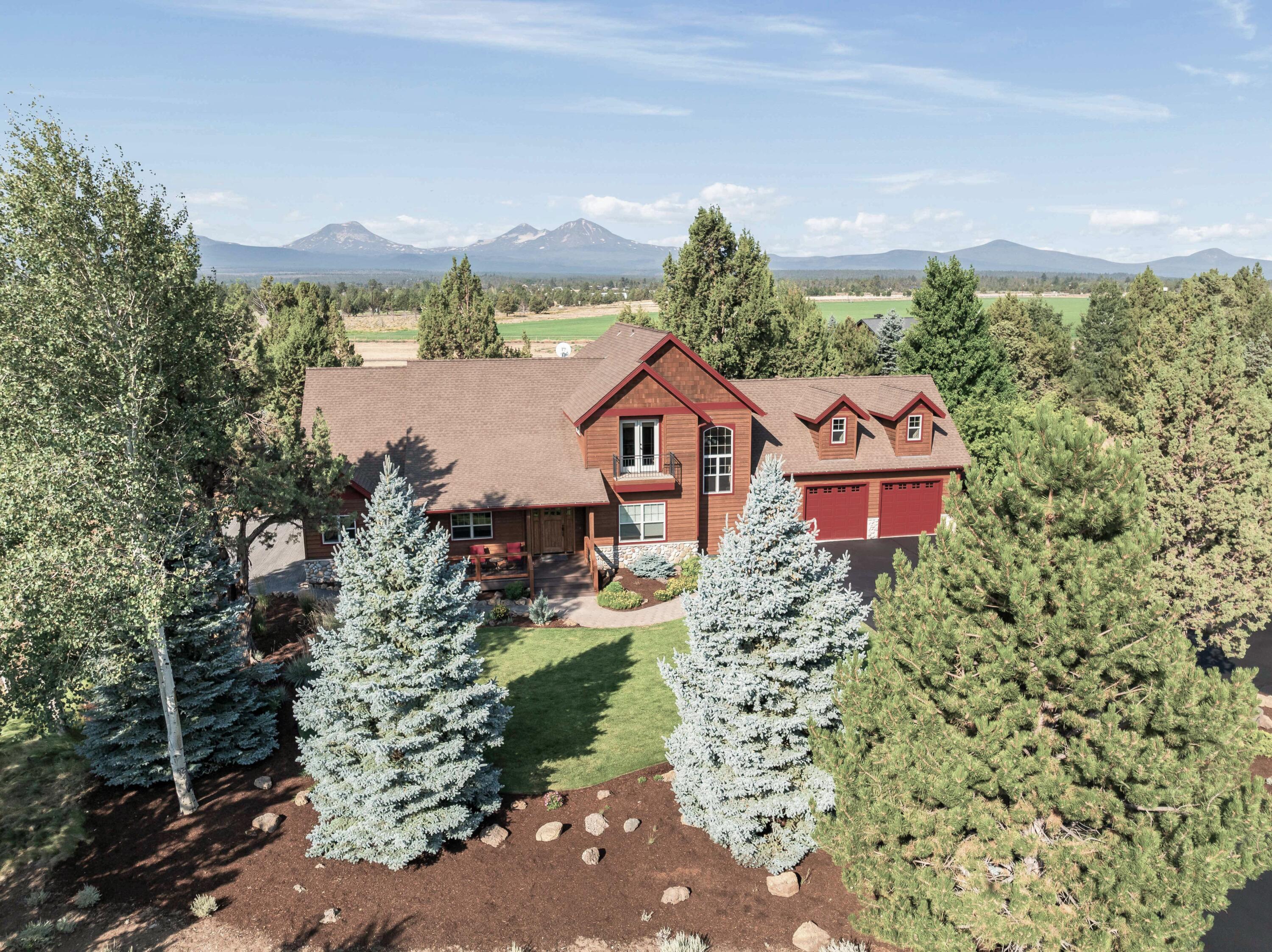 Exceptional equestrian property located on quiet cul-de-sac with craftsman style home and booming view of Three Sisters Mountains. Property features: Entire 10 acres fenced and cross fenced with wood rail and 2x4 no climb wire; 36x36 ft barn; Ample horse trailer parking; Heated/insulated tack room with sink and hot/cold water; 12x36 ft drive-through isle (10-ft overhead clearance); 3 stalls with large attached paddocks; 20x30 ft loafing shelter; BLM/USFS equestrian trailheads nearby; Large pond with waterfall feature; Home and barn recently stained/painted; New composite decking and large paver patio. Interior features: Open living floor plan with high vaulted ceilings; Wood flooring throughout main level; River rock fireplace; High end stainless appliances; Granite countertops; Primary bedroom with large walk-in shower, double vanity, soaking tub, 2 walk-in closets, deck access; Office on main level; Huge upper bonus room; Balconies on upstairs bedrooms.