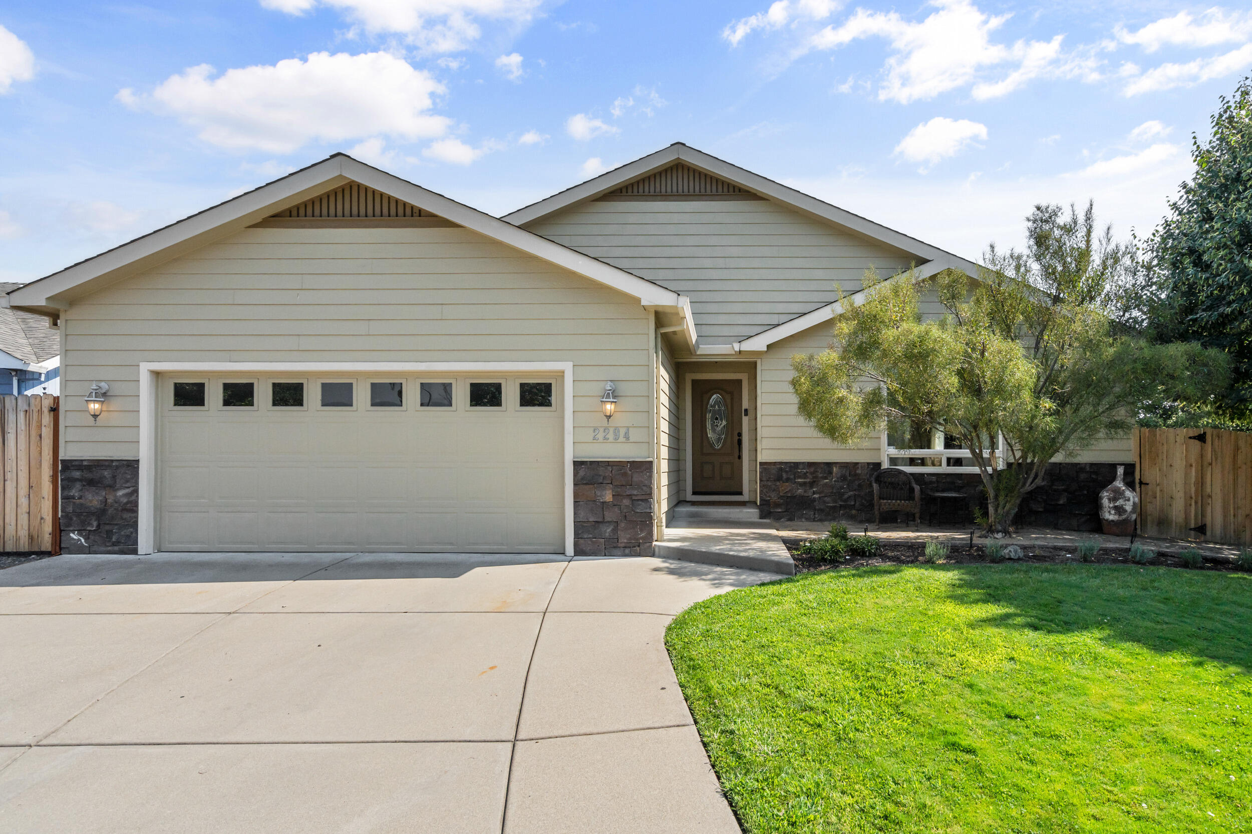 This beautifully maintained 3-bedroom, 2-bath home offers 1,771 sq. ft. of thoughtfully designed living space in the desirable Candlewood subdivision. The inviting open floor plan features vaulted ceilings, a cozy gas fireplace, and plenty of natural light—perfect for both everyday living and entertaining. The primary suite is a true retreat with a walk-in closet, dual vanity sinks, and private access to the covered back patio. Outside, enjoy the low-maintenance yard and covered patio, ideal for outdoor dining or quiet mornings.