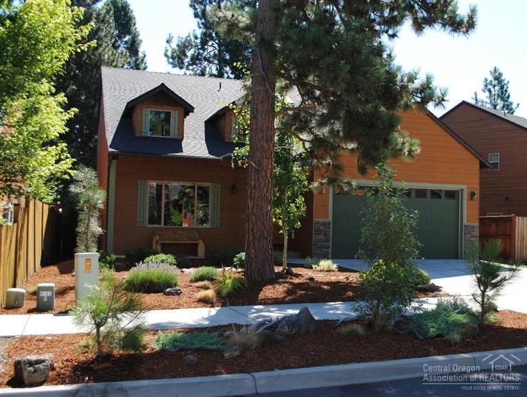 Fabulous home in a charming and quiet SW Bend neighborhood! This 4 bd, 2.5 bath home is absolutely move-in ready. It has huge vaulted ceilings & a gas fireplace in the living room. The large kitchen has stone counters, hickory cabinets, stainless appliances, oversized island & hardwood floors. The main level master features a large bathroom with a soaker tub and double sinks. Upstairs boasts a large bonus room with 3 large bdrms and a full bathroom. Close to The Old Mill, downtown Bend and the river trails!