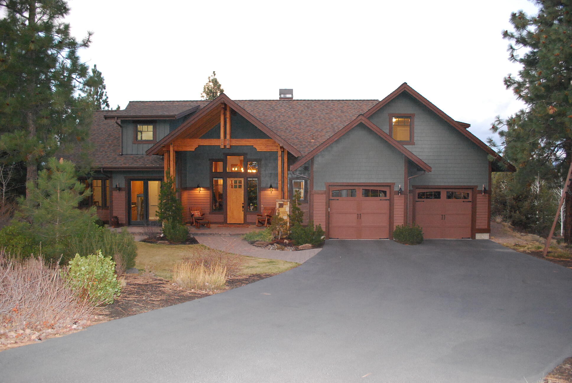 Enjoy amazing sunsets and mountain views from the back of this stunning, custom lodge style home in the lovely Three Pines neighborhood!  Grand entry has vaulted ceilings with wood beams and huge picture windows that look out upon a private, beautifully landscaped yard surrounded by tall pines.  Superbly constructed, this light, bright and impeccably maintained home boasts a dramatic main floor Great Room with stone fireplace, Master Suite with Luxury Bath and walk in closet, high end Chef's Kitchen, private office and mud room.  Second floor has separate multigenerational living spaces with a huge guest bedroom/bath on one end and a beautifully appointed 2 BR Guest Suite with kitchenette and bonus room on the other.  Multiple heat/AC zones.  3 car tandem garage with an extra gear room and workspace!  Ultimate NW location - hike or bike to Shevlin Park, close to schools, shopping and downtown Bend.