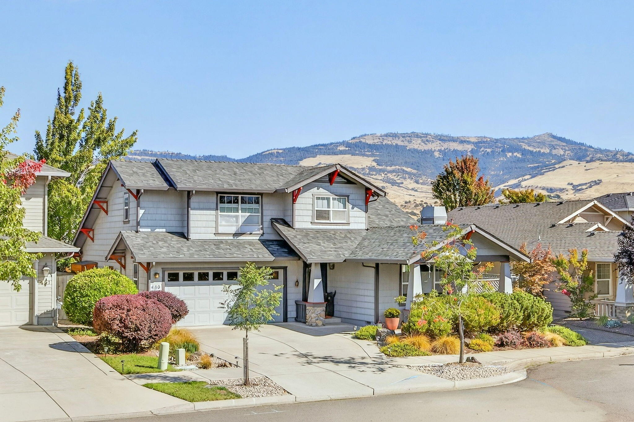 This lovely neighborhood of Craftsman styled homes is conveniently located close to downtown.  The warm and welcoming home has lots of natural light and has been conscientiously cared for and updated.  The floor plan is open, with light oak floors in the living room, dining and kitchen, with view of Grizzly Peak, leading to a private back patio perfect for relaxed outdoor living and entertaining.  Spacious main bedroom, bath and office upstairs, 2 guest bedrooms and full bath down.  Some of the many other features to enjoy here are - quartz counters, spacious covered front porch for evening visits with neighbors, beautiful stained glass and cedar fence along the back patio, low maintenance, deer proof, low water landscaping front and back on drip irrigation, gas fireplace in the living room with storage under it, skylights... More updates/upgrades include - roof, appliances, and water heater have been replaced, also a new 2 zoned heat pump and furnace. And no HOA dues!  Welcome home.