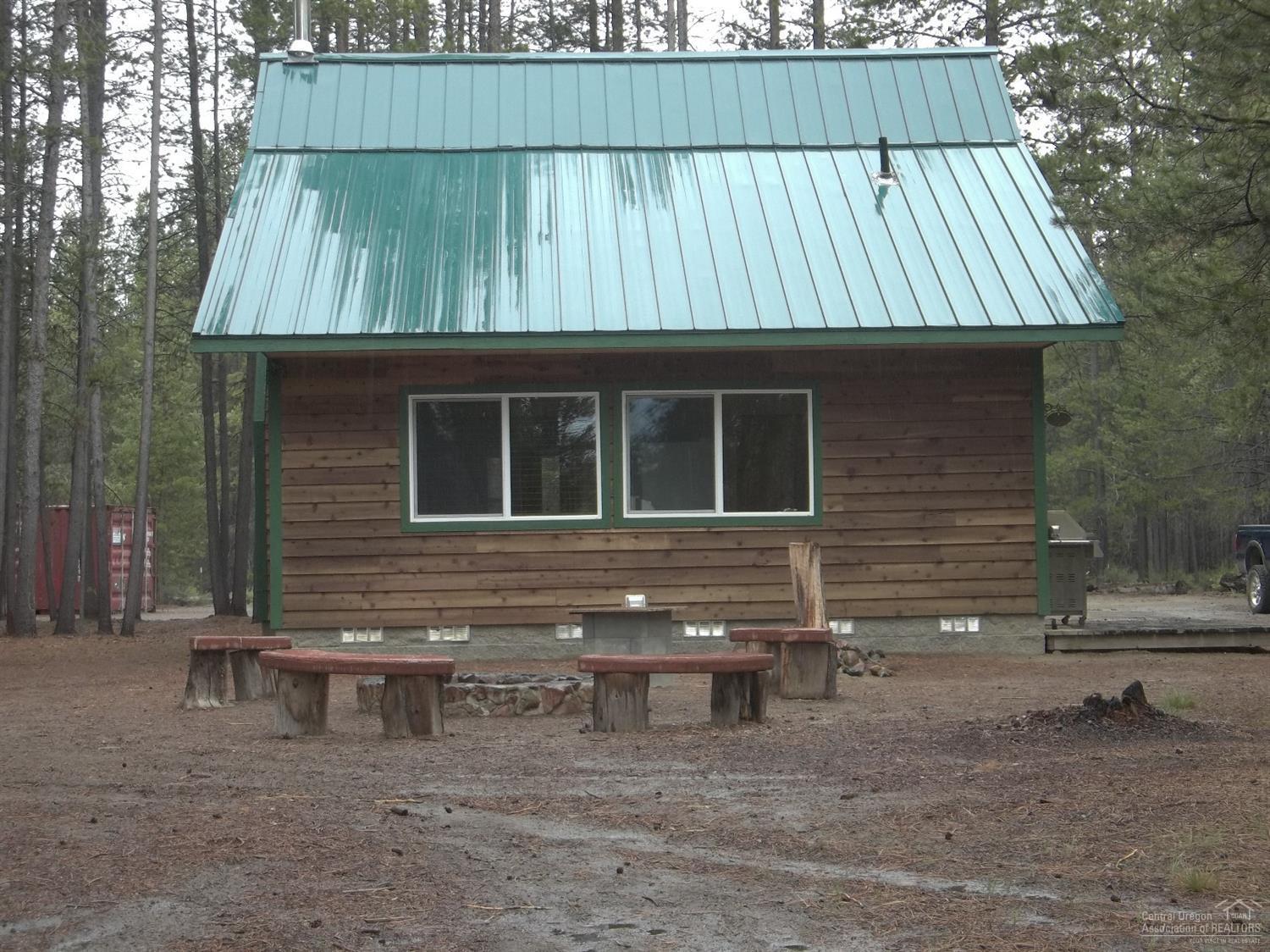 Super cute and move in ready cabin on the river. Great place to fish, deer and elk hunt, snowmobile, hike or just enjoy the quiet peaceful area. Includes two metal storage containers, wood shed, nice fire pit, private well. Home also has newer ductless heat and AC system plus wood stove. Nice loft bedroom, plus a bedroom downstairs. Must see to appreciate.