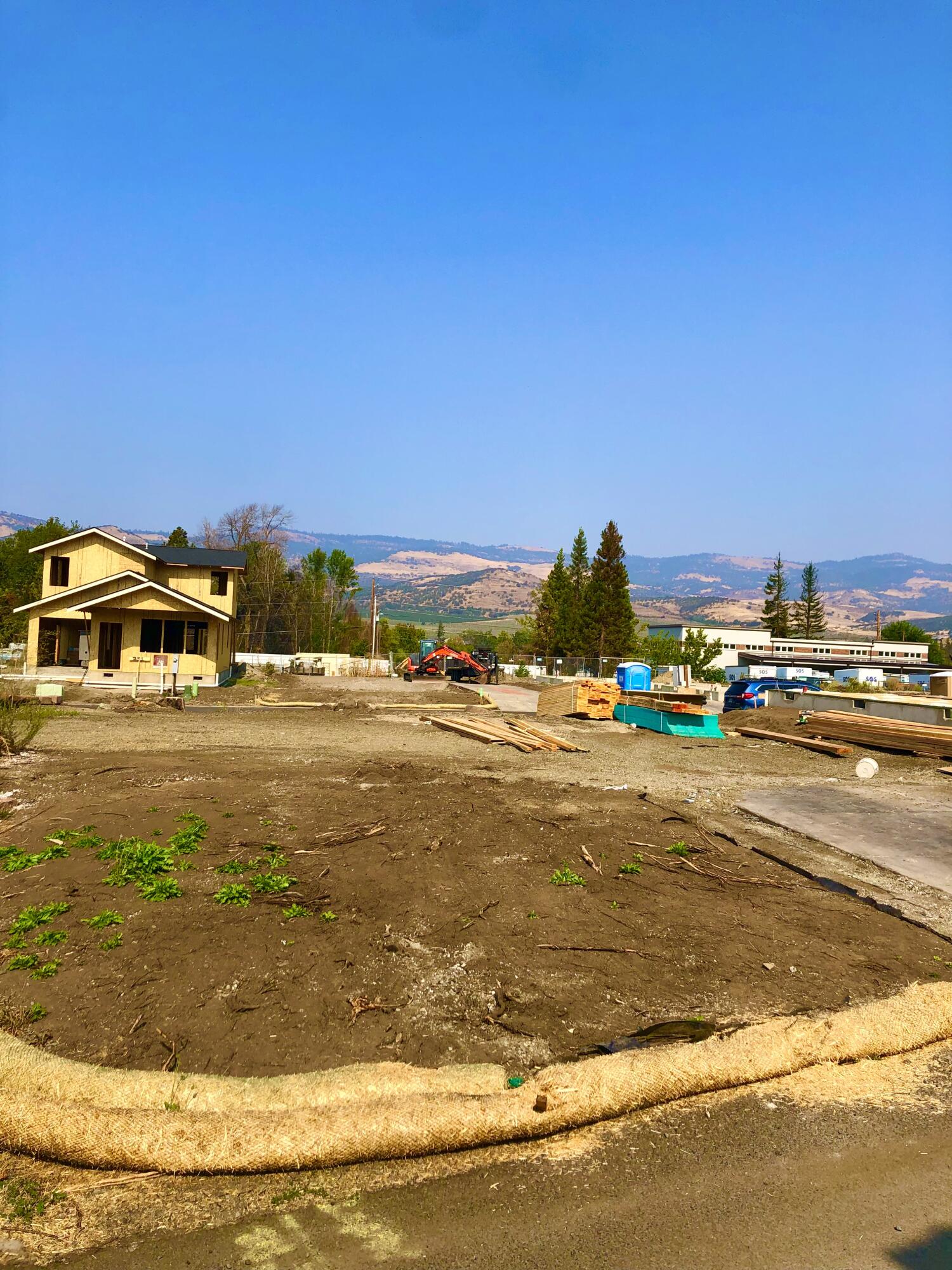 Great corner lot in Talent's Old Bridge Village.  The previous home was 1800 sq feet with at 2 car garage. The lot provides close access to the Wagner Creek open space and is just a few blocks to the delights of Downtown Talent! The Property has been cleared by FEMA.