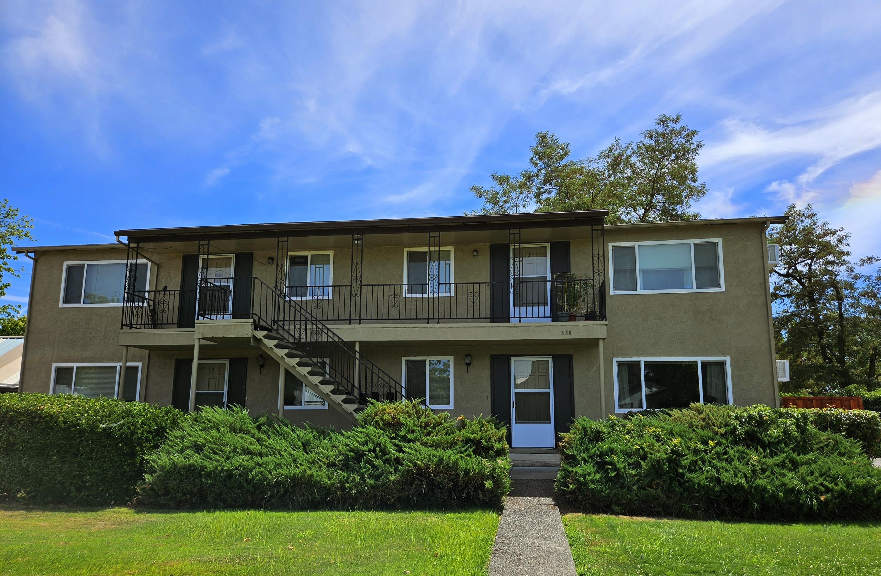 Great looking 4-Plex that dials in all the right numbers! Fully tenant occupied, clean, non-smoking and well maintained with a strong rental and operational history, this investment will not disappoint. All units are 960 sq ft, with two bedroom, one bath, carpet and vinyl flooring, electric heating and wall AC for cooling. All appliances are electric. Other bonuses include newer thermal windows throughout and an onsite laundry and storage area. Tenants appreciate the short distance to area shops and restaurants, banking, and nearby medical and travel services.