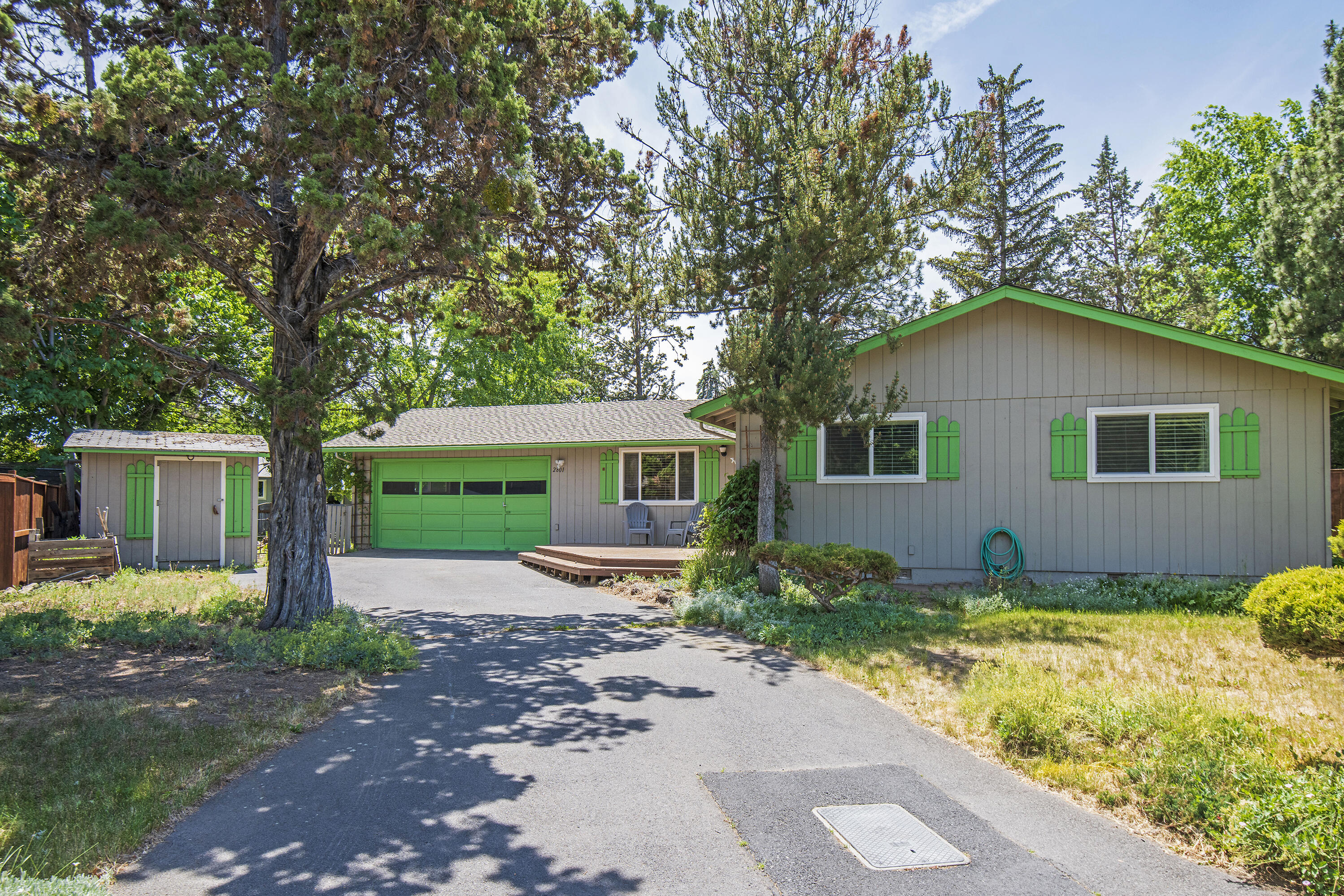 Perfect single level starter home on a quarter acre lot in a quiet NE Bend cul-de-sac! Don't miss this fantastic opportunity to make this home yours and everything you envision it to be! Home features new heat pump and furnace with A/C, large living room with beautiful vintage wood stove and lava rock surround, separate dining area, kitchen with newer appliances and additional eating area or living space, large laundry room and pantry, primary suite and attached bath with tile counters and floors, two spare bedrooms with full sized hall bath and shower/tub combo. Outside features include 2 storage sheds, newer roof, front deck, rear patio and rear deck with pergola and lots of space for yard and landscaping.