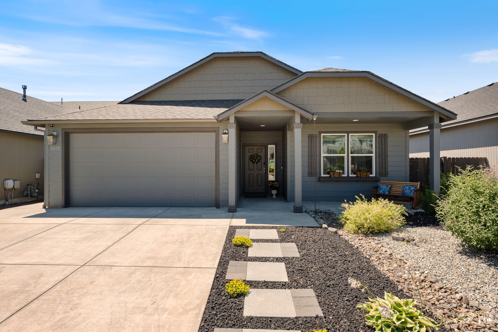 This meticulously maintained single-level home offers 3 bedrooms, 2 full baths, and many upgrades. Enjoy cooking on a gas stove in the modern kitchen that opens up to the living and dining spaces. Kitchen appliances new in 2023. Primary bedroom fits king-size furniture, has an electric fireplace, and has top-down-bottom-up shades. Primary bath has a walk-in closet, water closet, and separate shower and tub. Cozy up by the gas fireplace in the living room or relax on the paved backyard patio surrounded by low-maintenance landscaping. Fully fenced yard with timed sprinkler/drip system. The home includes a 2-car garage equipped with an EV charger. With its clean design, practical layout, and excellent care, this home is move-in ready and full of comfort and convenience.