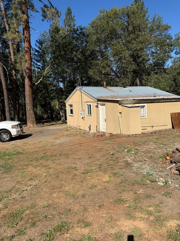 Incredible opportunity to own over 6 acres in the Applegate Valley. 4 miles from Applegate Lake! Current home is a 2 bedrooms, 1 bathroom cottage with lots of potential. Buyer to do due diligence on condition of home and roof as a tree falling caused some damage to roof, attic and ceilings. Seller is willing to carry financing.