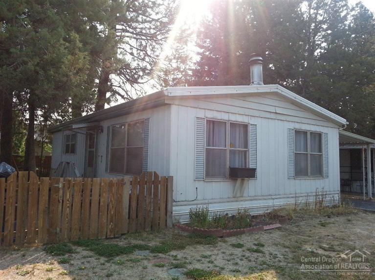 Location, Location, location!! Affordable living on Bend's Westside, walking distance to stores, eateries, and shops. This 2 bedroom, 2 full bath, 960 sq ft mobile only, has a cute kitchen with eating bar, roomy living room with lots of windows, laminate wood floors, and a wood burning fireplace. Home also features lots of storage, good size rooms, w/d hookups, carport, fenced backyard, and storage sheds. And did I mention location? Won't last!
