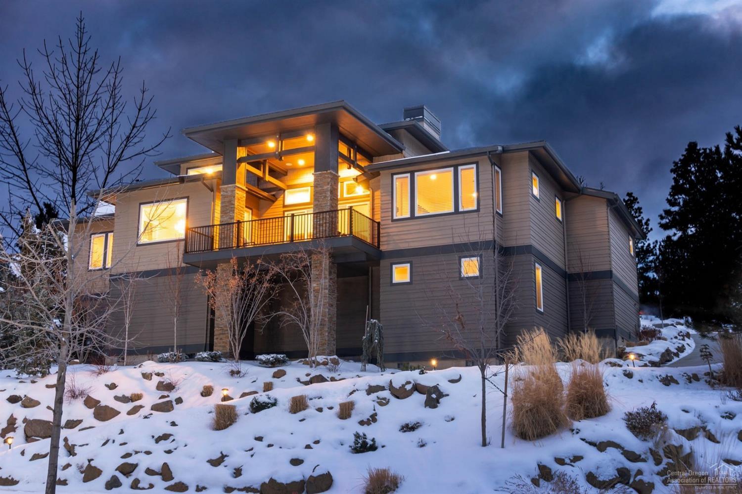 Stunning custom built home on Awbrey Butte with many high-end upgrades and finishes. Spacious open floor plan features all main level living with bonus media room downstairs, all media equipment included - ideal for entertaining. Enjoy the sunrise each morning from your covered deck, eastern views and ample windows and skylights flood home with natural light. Large lot features ample parking, privacy and heated driveway. Dual zone thermostats to keep home comfortable no matter the weather. The kitchen is a chef's dream: dramatic waterfall island, built in column refrigerator and freezer, walk in pantry and wine/beverage cooler. Attention to detail at every step. This home is truly a must see.