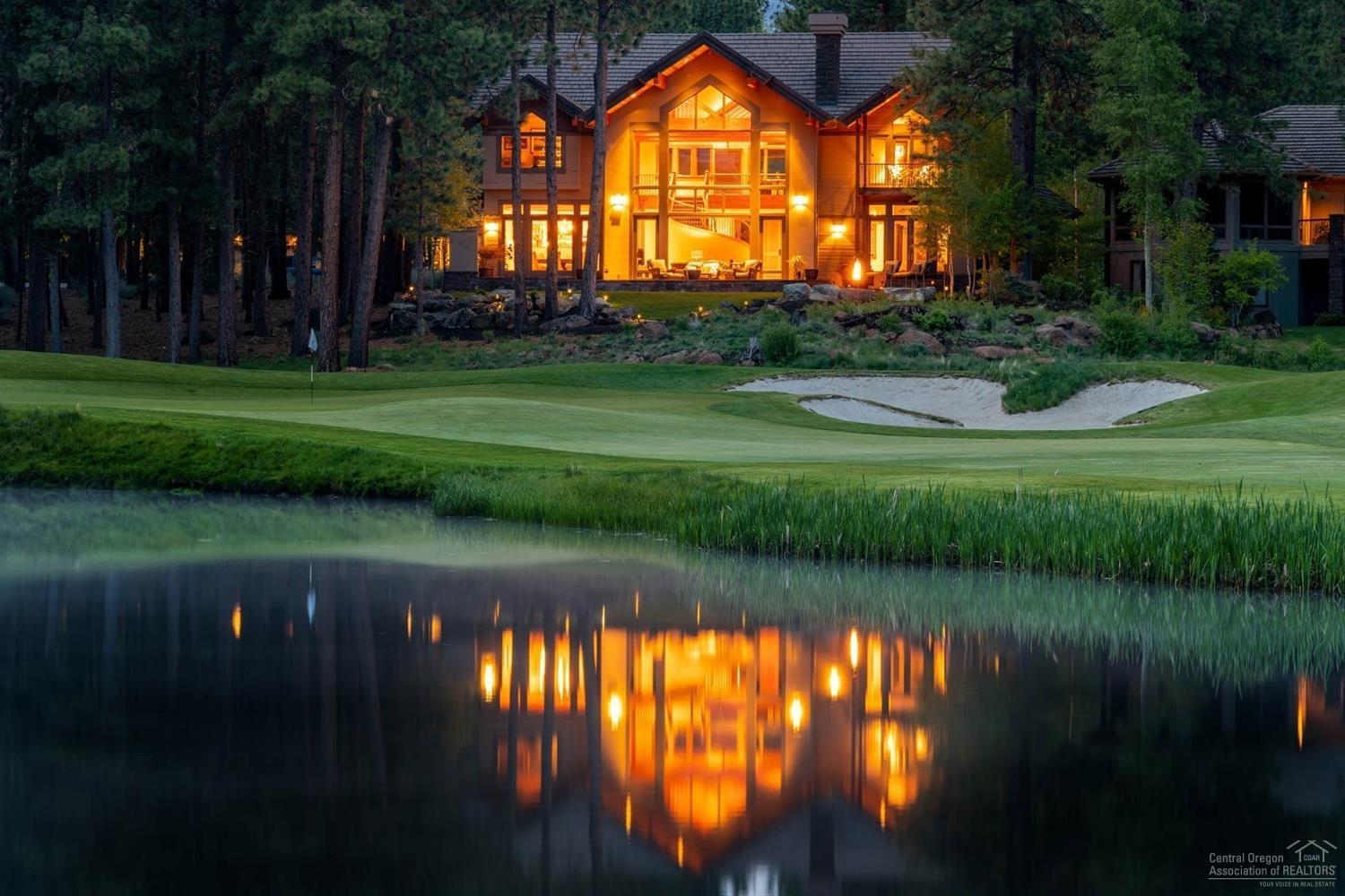 Mountain Modern Home perfectly situated to capture the best golf course & lake views in Broken Top! Bold accents & breathtaking views add even more glamour to already dramatic site; offering a fresh take on the classic lodge home with sweeping views & relaxing vibe. Massive great room windows capture amazing views from the moment you enter. Family style kitchen w/ top of the line appliances, double ovens, warming drawer, stainless farm sink, wine fridge & walk-in pantry and golf course view dining room. Tranquil main level master suite with views of lake & down fairway, a luxurious bath w/ free standing claw foot soaking tub, stacked rock wall, dual sinks & fabulous walk-in closet. The private office, w/ fireplace & access to spacious front courtyard & media/family room w/ fireplace & cross beam ceilings are also located on the main level. 3 lovely en-suite guest rooms for family & guests. Multiple outdoor spaces overlooking lake & golf course & courtyard w/ 2 water features & hot-tub.