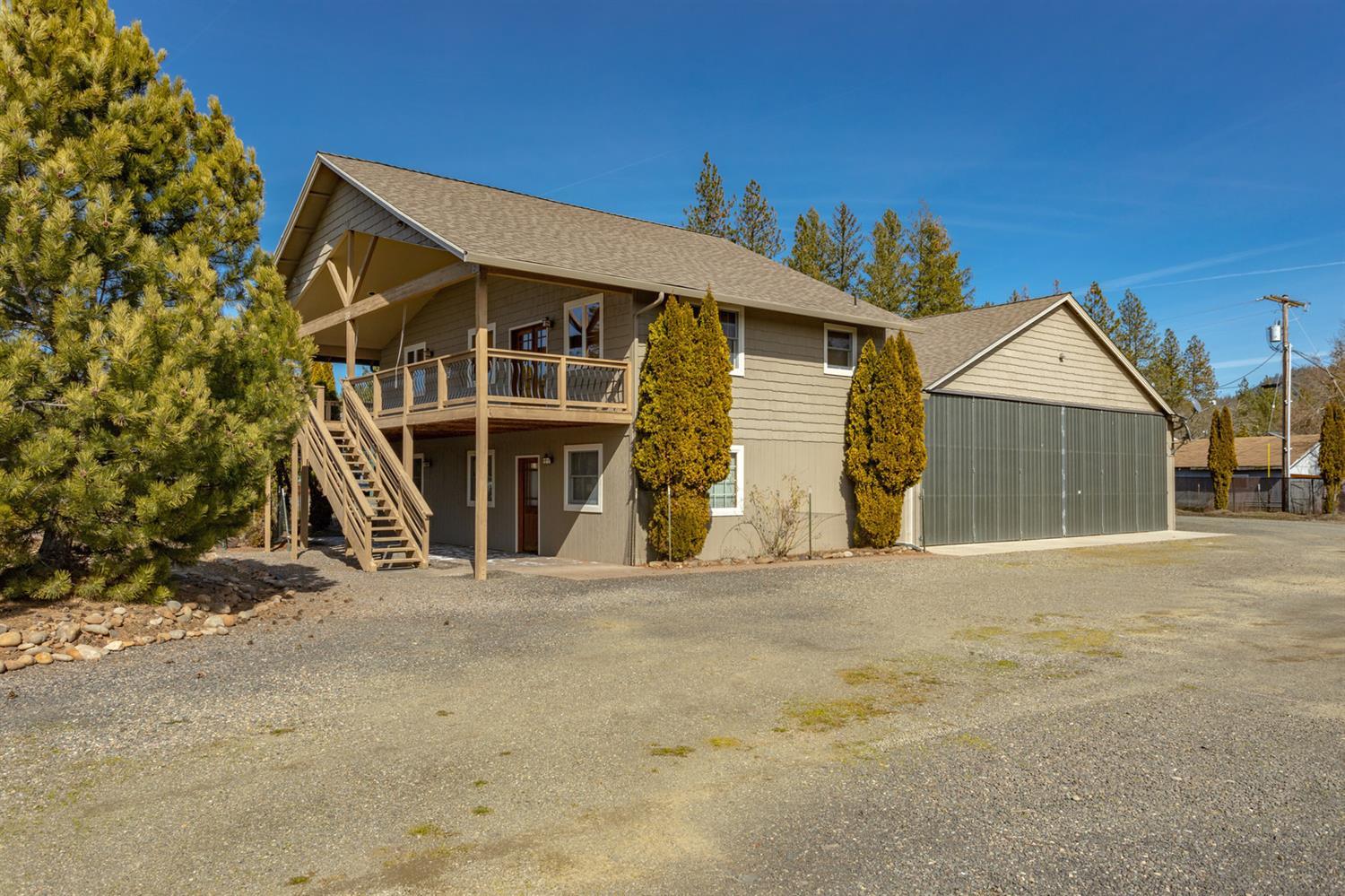 Live on a Private Airstrip in Shady Cove...located above the fog...fly most days! 2,000-sq. ft. hangar with 220 and 42-ft sliding doors. Direct access to 2,500-ft. runway. Unique 1,840-sq. ft. two story home built in 2005 featuring 2-bedrooms & 2-bathrooms. Each level has its own bedroom, bathroom and kitchen. Upstairs level has a beautiful rock fireplace with custom wood mantle, vaulted ceiling, granite kitchen countertops, stainless steel appliances and deck with mountain views. Room for RV parking. Two-family setup is possible. City sewer, good well, .72-acre lot.